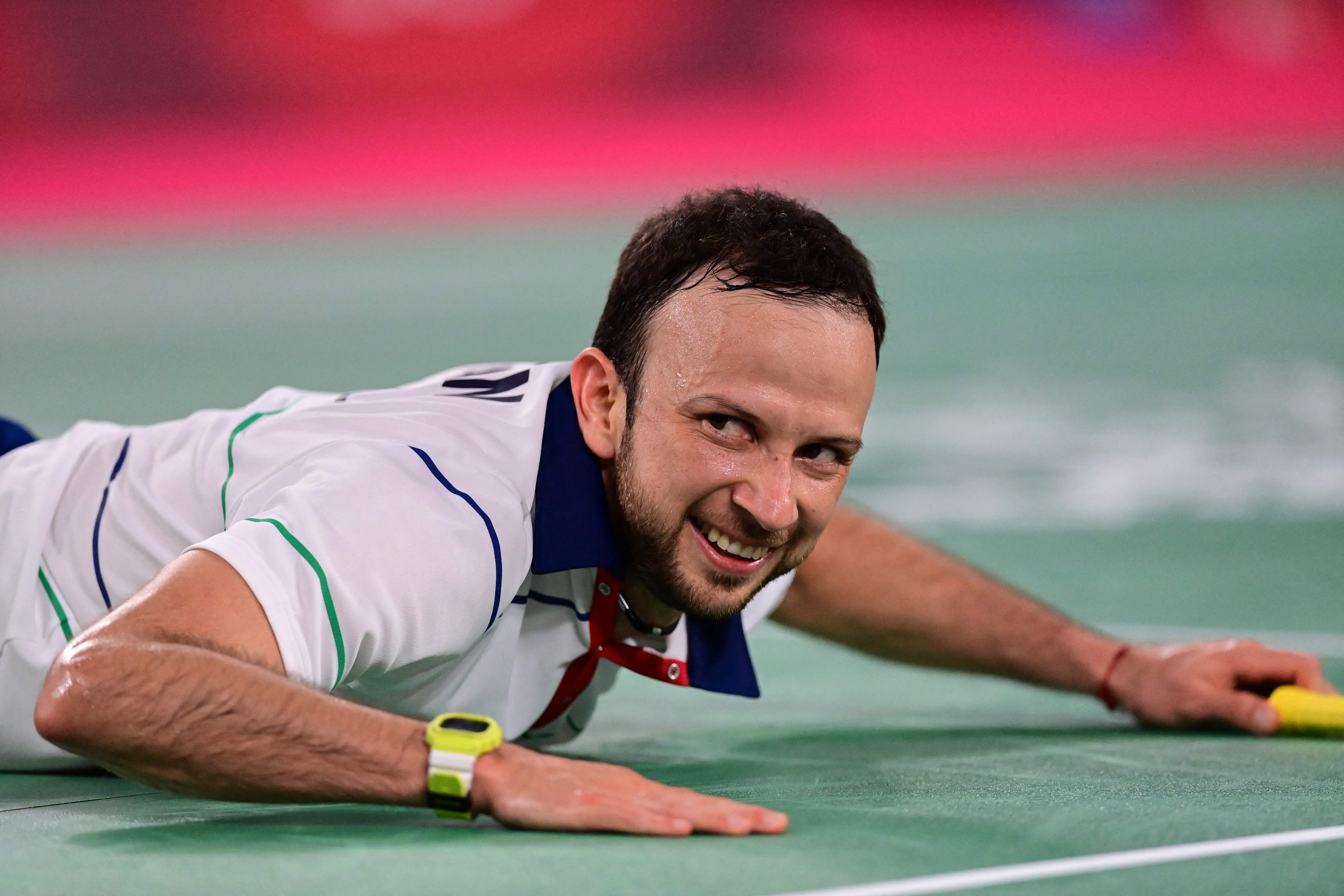 Guatemala's Kevin Cordon reacts after a point with Denmark's Viktor Axelsen in their men's singles badminton semi-final match during the Tokyo 2020 Olympic Games at the Musashino Forest Sports Plaza in Tokyo on August 1, 2021. (Photo by Pedro PARDO / AFP)