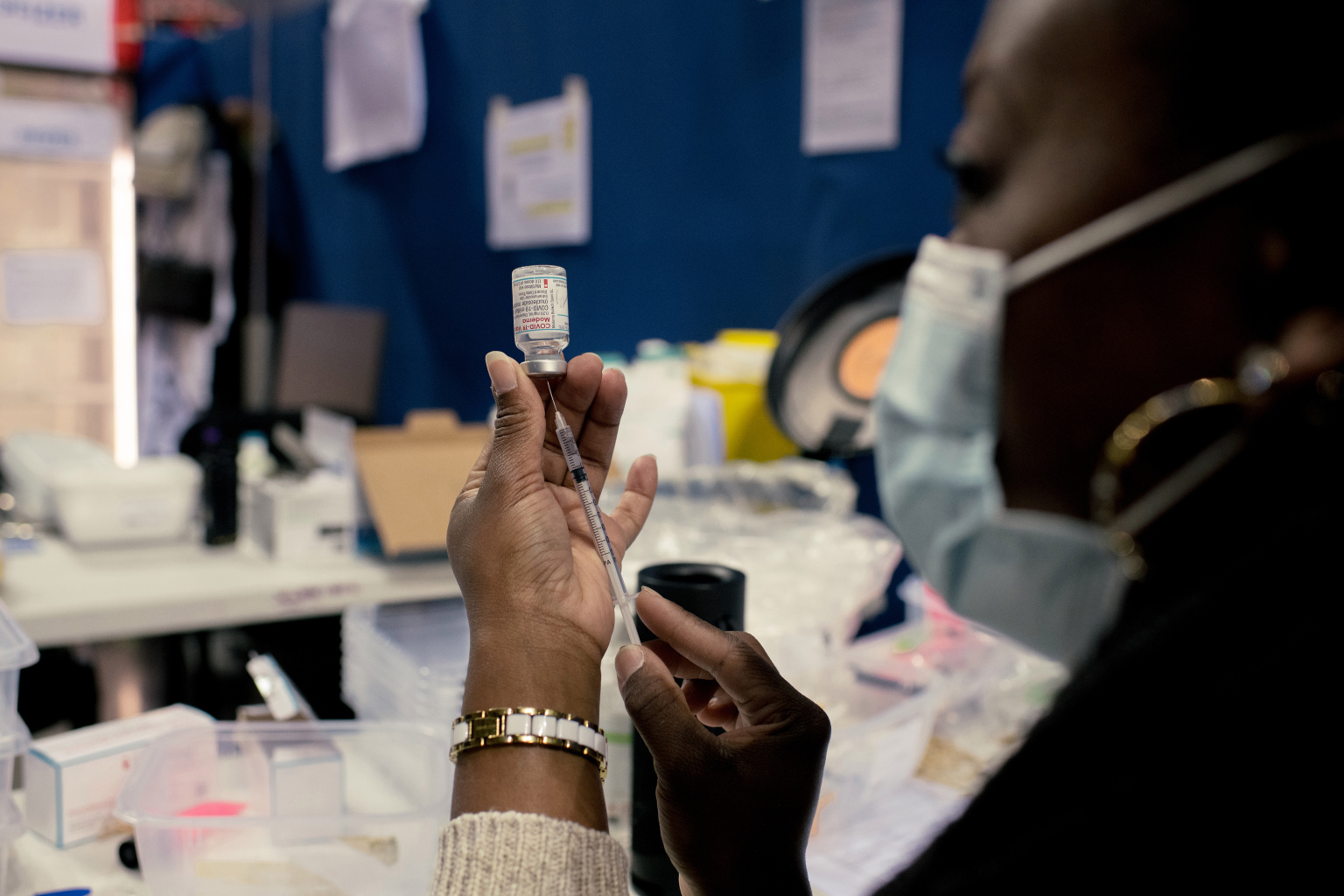 FILE -- A health care worker prepares a Moderna COVID-19 vaccine in Montigny-le-Bretonneux, France, on April 9, 2021. Scientists have long theorized that giving people two slightly different vaccines might generate a stronger immune response. (Dmitry Kostyukov/The New York Times)