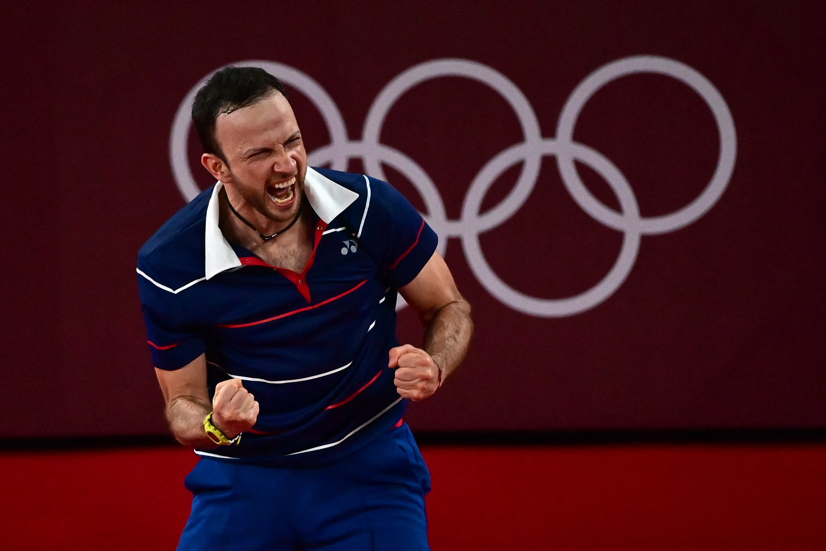 Guatemala's Kevin Cordon celebrates his win over Netherlands' Mark Caljouw in their men's singles badminton round of 16 match during the Tokyo 2020 Olympic Games at the Musashino Forest Sports Plaza in Tokyo on July 29, 2021. (Photo by Pedro PARDO / AFP)