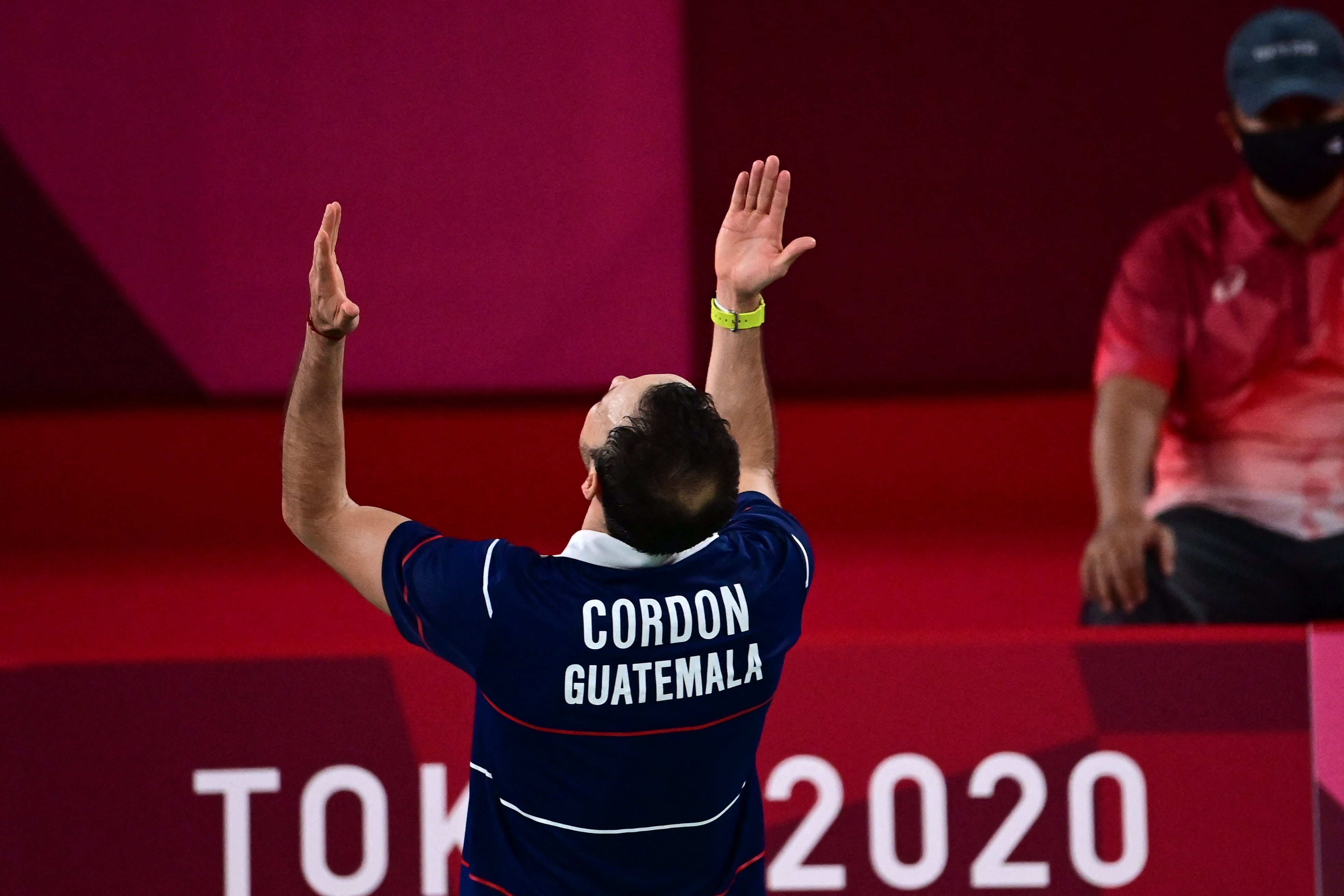Guatemala's Kevin Cordon celebrates his win over Netherlands' Mark Caljouw in their men's singles badminton round of 16 match during the Tokyo 2020 Olympic Games at the Musashino Forest Sports Plaza in Tokyo on July 29, 2021. (Photo by Pedro PARDO / AFP)