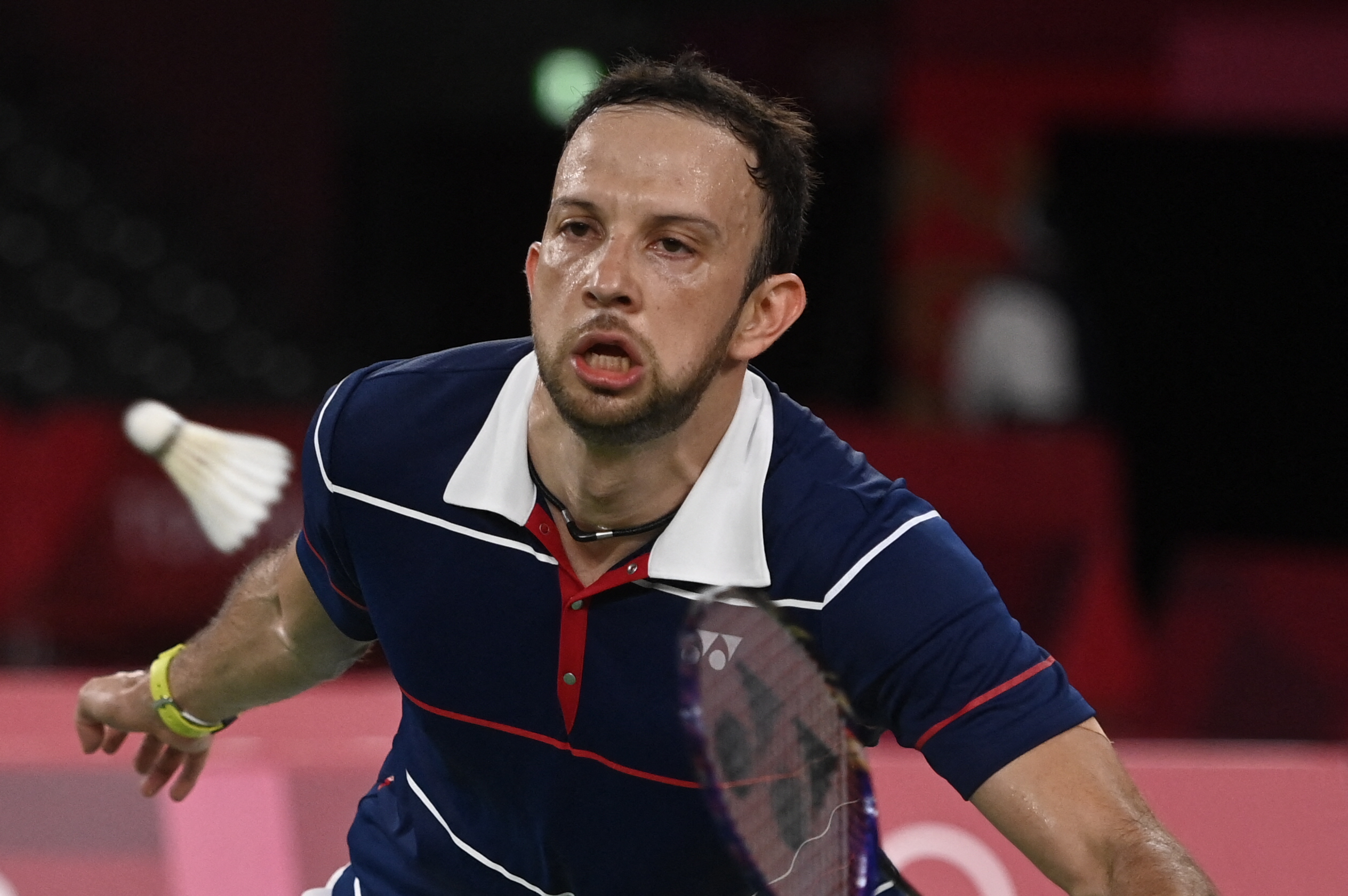 Guatemala's Kevin Cordon hits a shot to Indonesia's Anthony Sinisuka Ginting in their men's singles badminton bronze medal match during the Tokyo 2020 Olympic Games at the Musashino Forest Sports Plaza in Tokyo on August 2, 2021. (Photo by Alexander NEMENOV / AFP)
