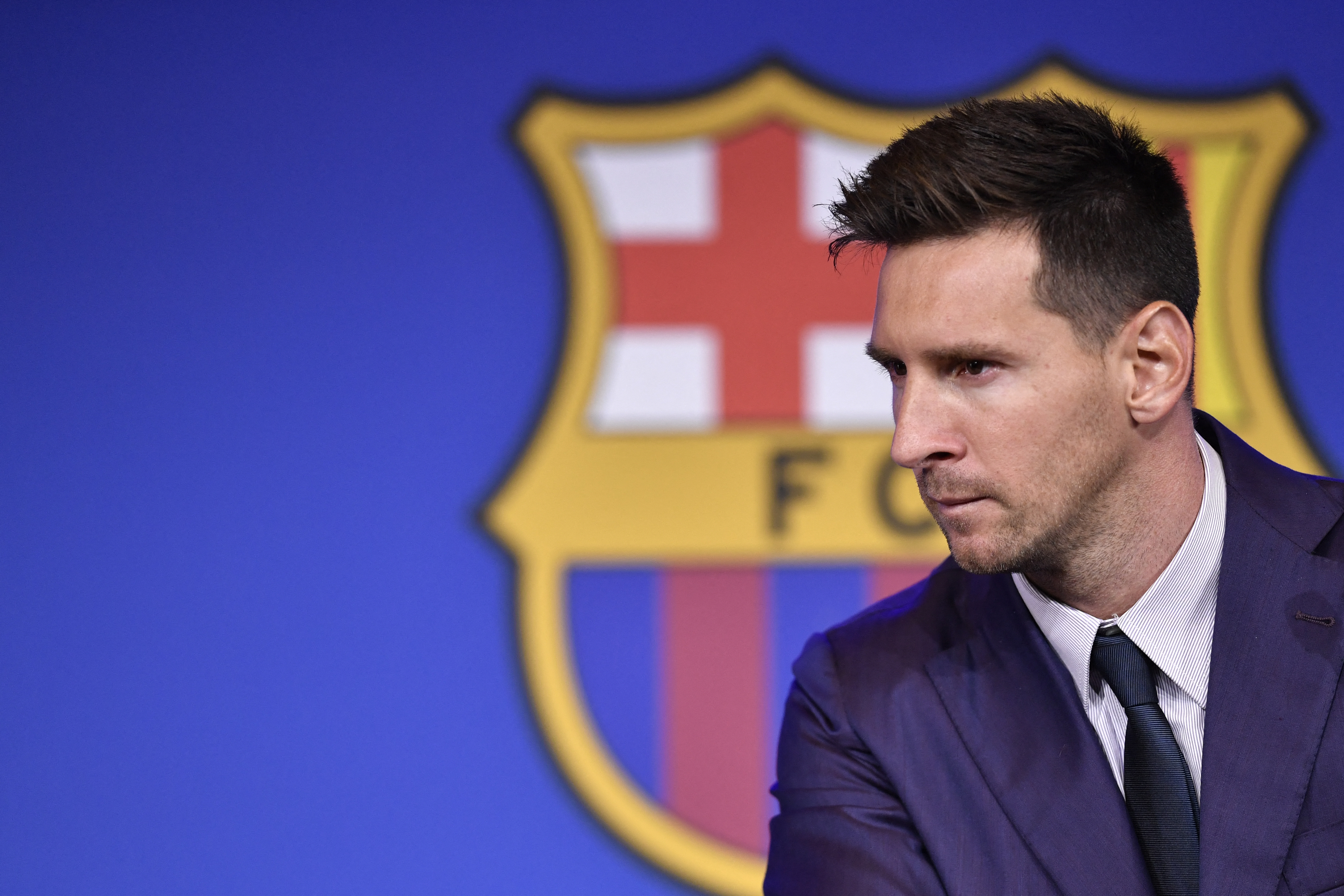 Barcelona's Argentinian forward Lionel Messi holds a press conference at the Camp Nou stadium in Barcelona on August 8, 2021. - Messi fought back tears as he began a press conference at which he confirmed he is leaving Barcelona, where he has played his entire career. (Photo by Pau BARRENA / AFP)