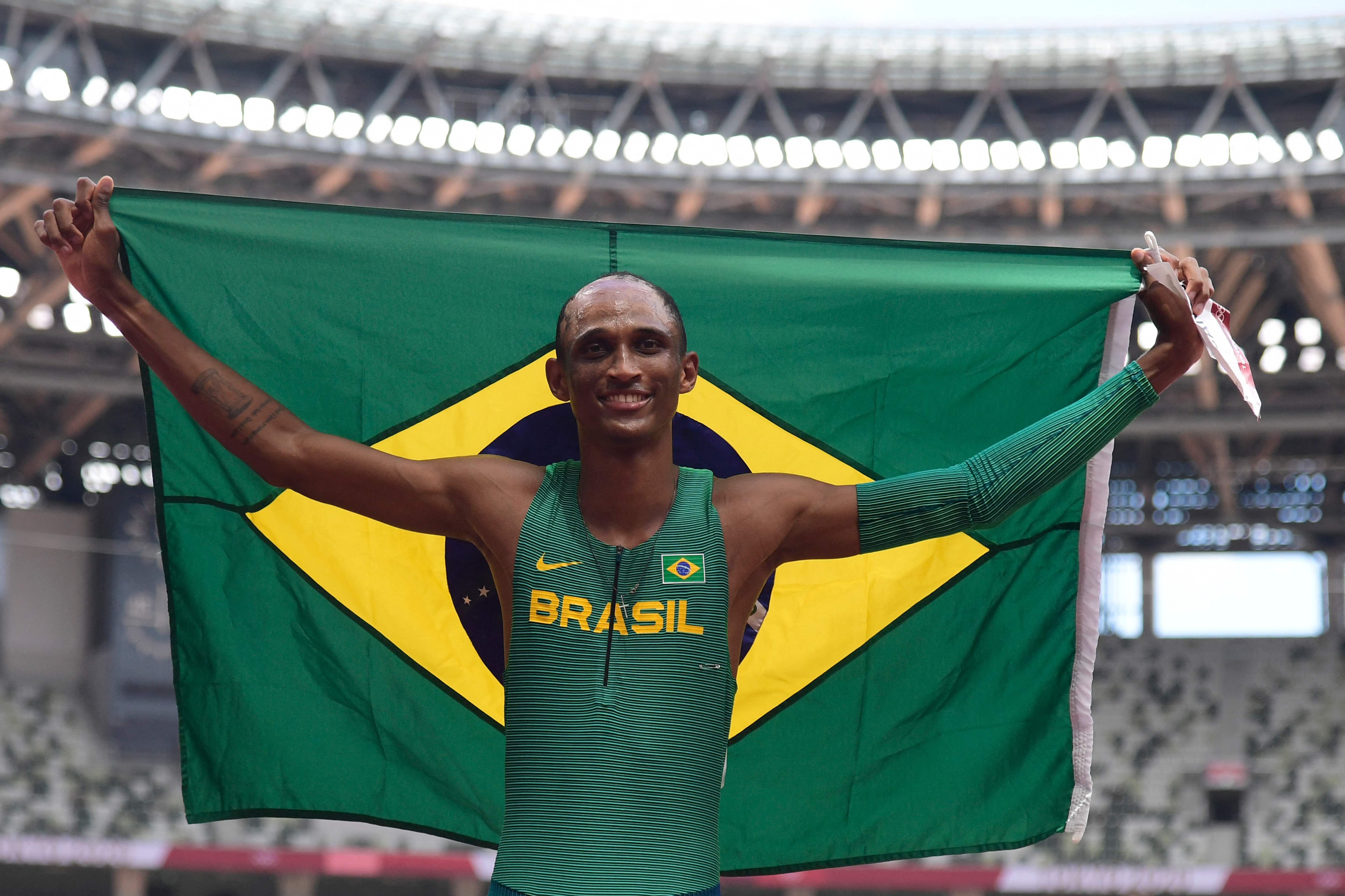 Brazil's Alison Dos Santos celebrate after taking third place in the men's 400m hurdles final during the Tokyo 2020 Olympic Games at the Olympic Stadium in Tokyo on August 3, 2021. (Photo by Javier SORIANO / AFP)