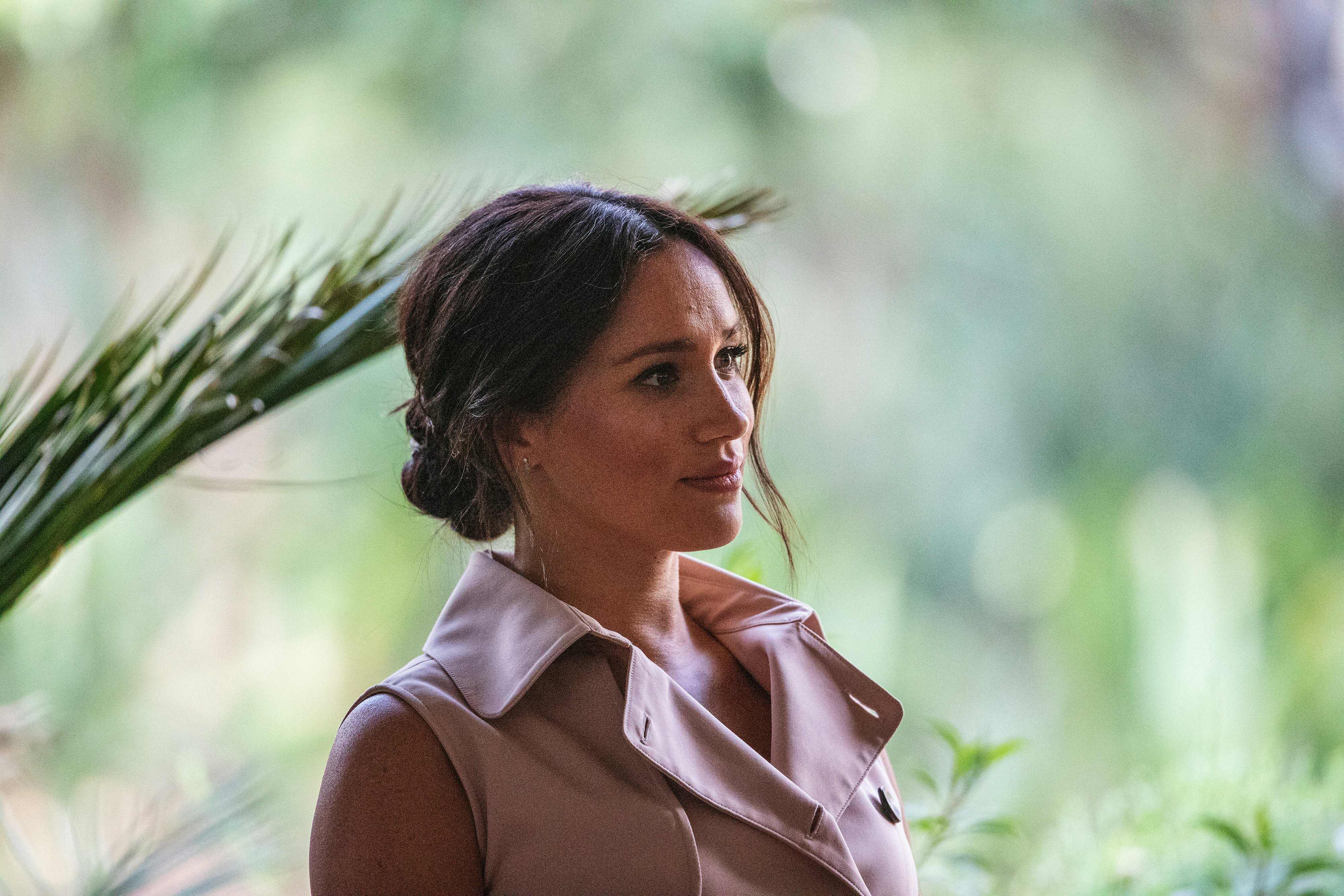 (FILES) In this file photo taken on October 02, 2019 Meghan, the Duchess of Sussex arrives at the British High Commissioner residency where she will meet with Graca Machel, widow of former South African president Nelson Mandela, in Johannesburg. - Meghan Markle, the Duchess of Sussex, marked her 40th birthday August 4, 2021 with a video asking celebrity friends to help women get back to work after the pandemic. (Photo by Michele Spatari / AFP)