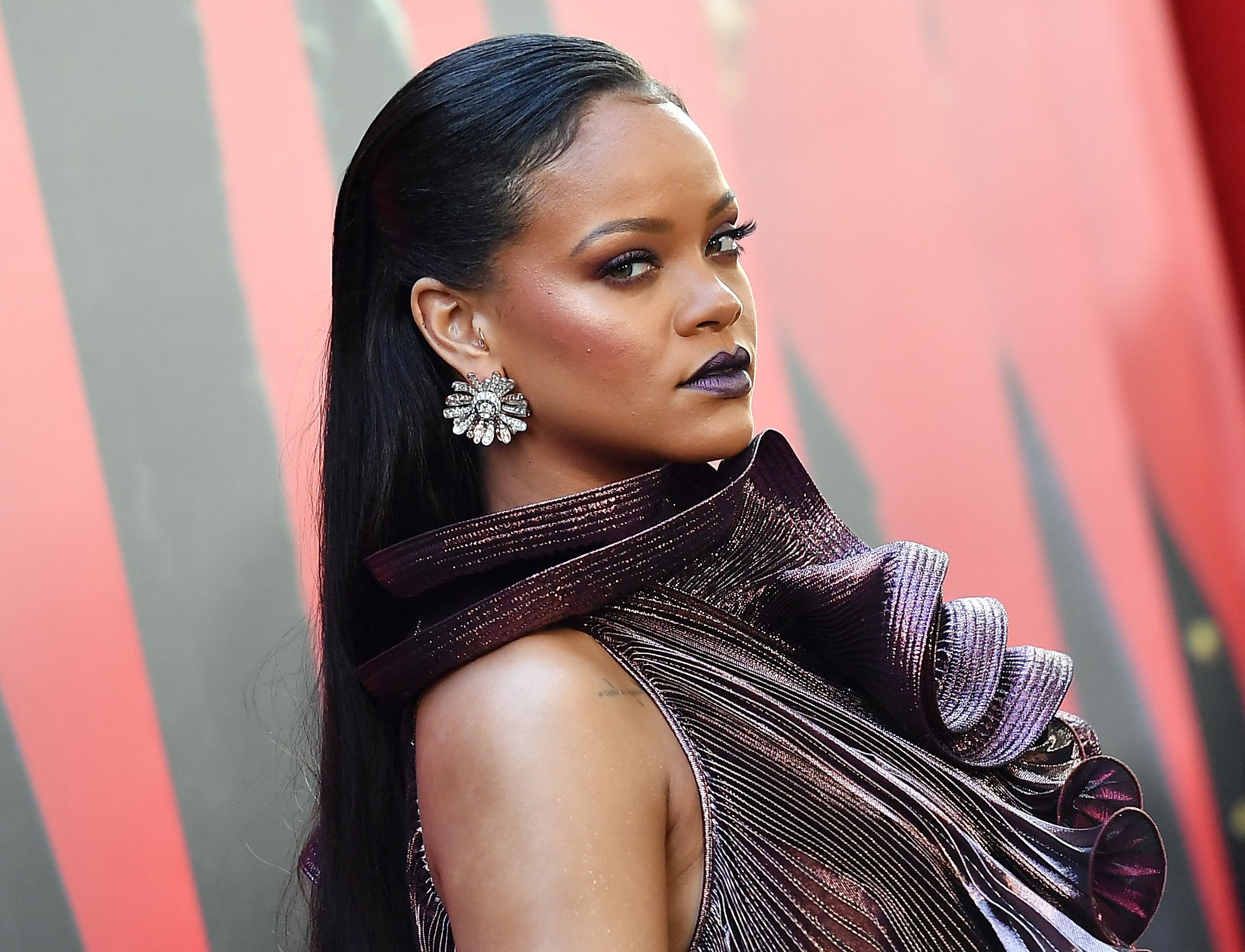 (FILES) In this file photo taken on June 5, 2018 Singer/actress Rihanna attends the World Premiere of OCEANS 8 in New York. - Singer and businesswoman Rihanna is worth a whopping $1.7 billion, Forbes said Wednesday, making her one of the richest woman musicians on the planet. (Photo by ANGELA WEISS / AFP)