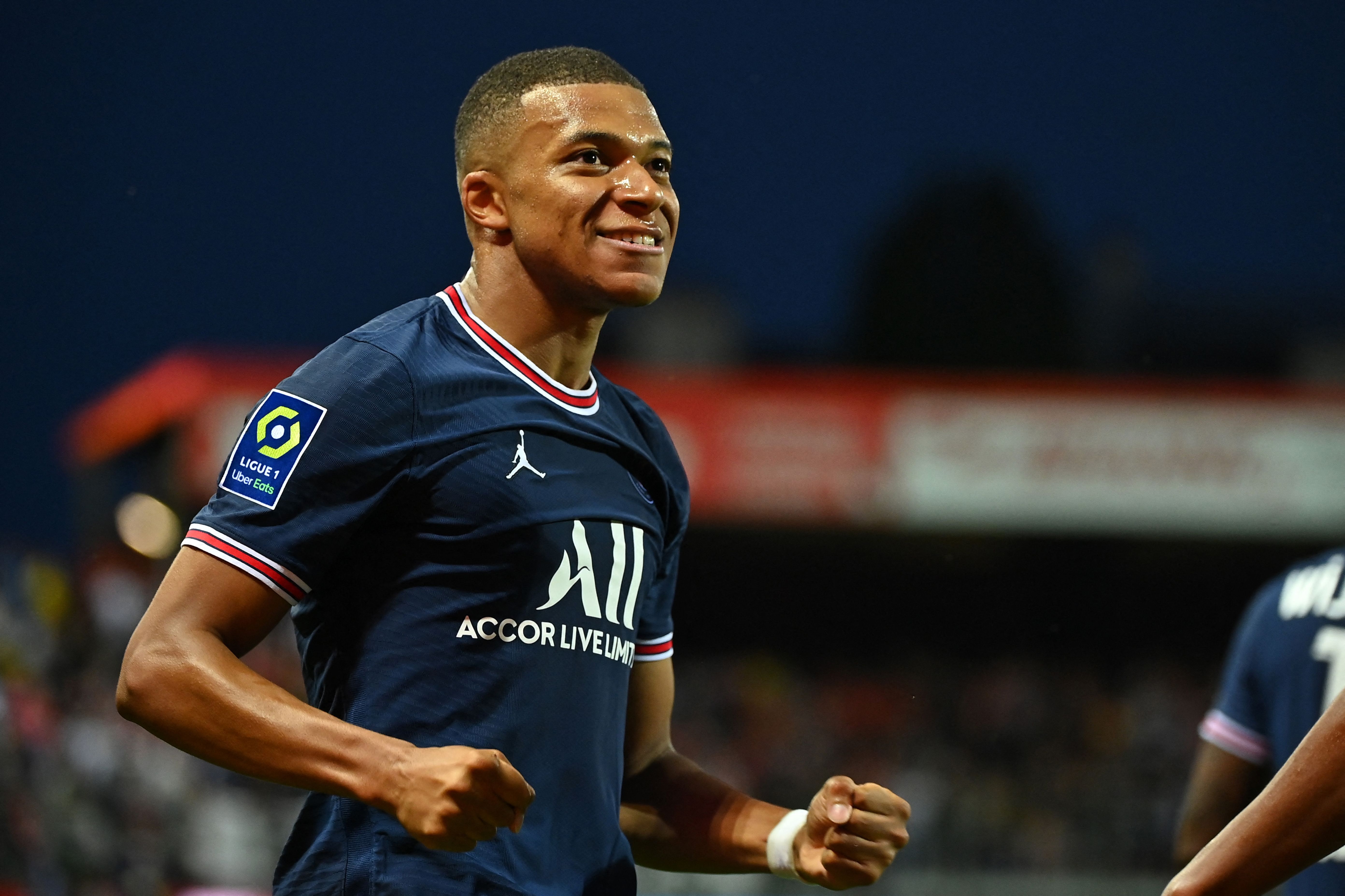 Paris Saint-Germain's French forward Kylian Mbappe celebrates after scoring a goal during the French L1 football match between Stade Brestois and Paris Saint-Germain at Francis-Le Ble Stadium in Brest on August 20, 2021. (Photo by LOIC VENANCE / AFP)