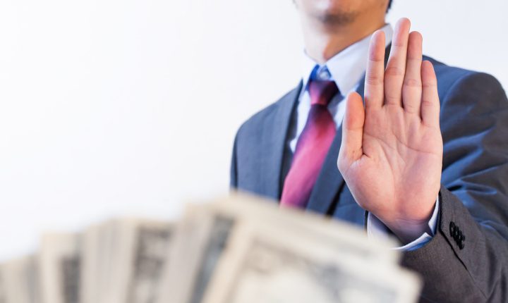 Businessman refuses to receive money - no bribery and corruption concept