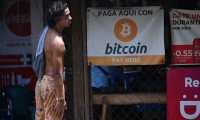 A man is seen in a store where bitcoins are accepted in El Zonte, La Libertad, El Salvador on September 4, 2021. - The Congress of El Salvador approved in June a law that will make bitcoin legal tender in the country from September 7, with the aim of boosting its economy although analysts warn of a negative impact. (Photo by MARVIN RECINOS / AFP)