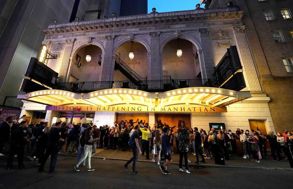 People wait to attend the Broadway musical "Hamilton" after showing their vaccination cards on September 14, 2021 at the Richard Rodgers Theatre in New York, as the highest grossing Broadway musical of all time returns after being dark for 18 months due the coronavirus pandemic. - Lion King, Wicked and Chicago also opened for the fully vaccinated (Photo by TIMOTHY A. CLARY / AFP)