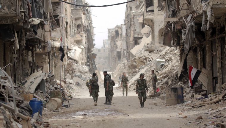 Damascus (Syrian Arab Republic).- PICTURES OF THE DECADE Syrian soldiers patrol at the Yarmouk Camp district in south Damascus, Syria, 22 May 2018. (Siria, Damasco) EFE/EPA/YOUSSEF BADAWI *** Local Caption *** 54689621