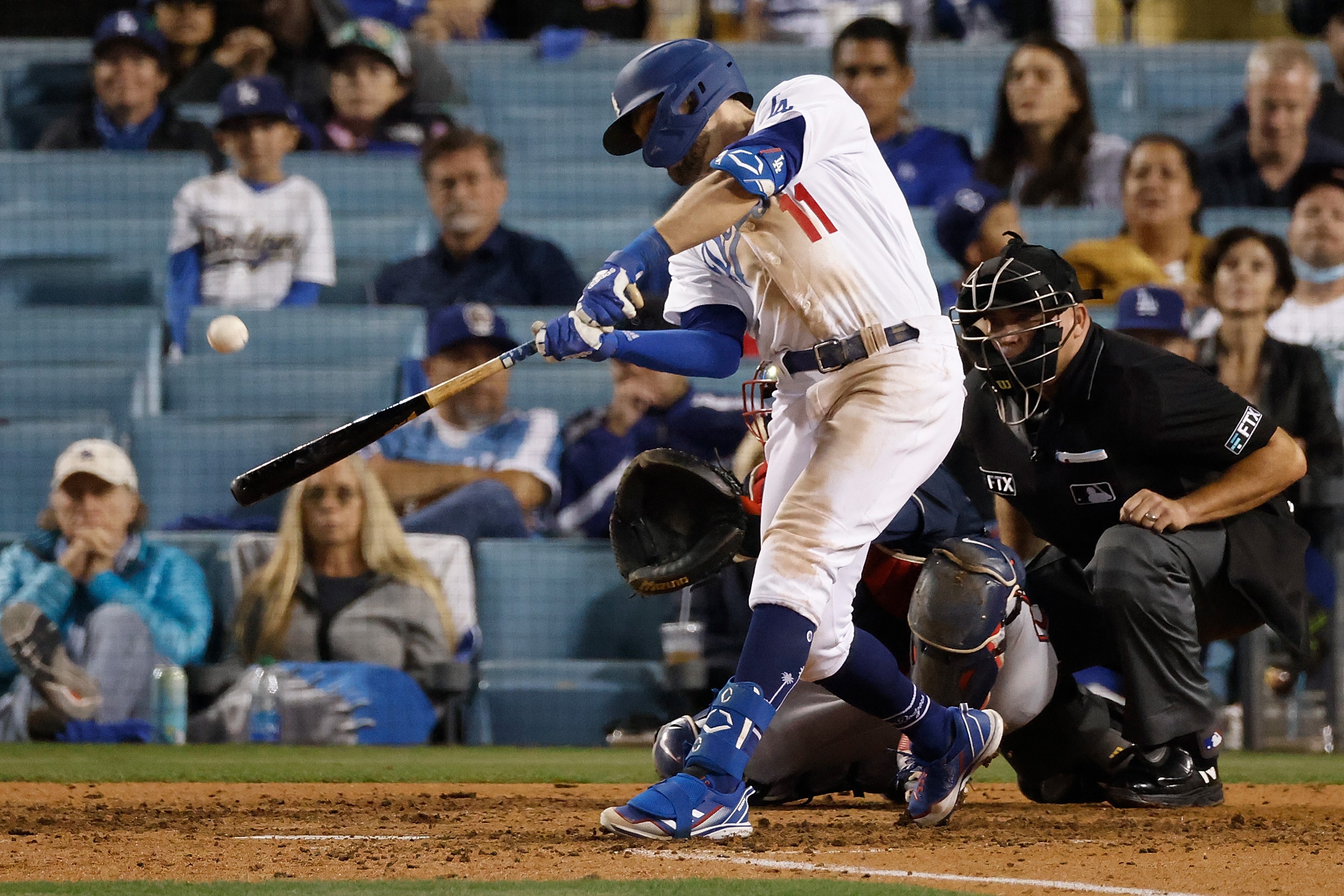 LOS ANGELES, CALIFORNIA - OCTOBER 21: AJ Pollock #11 of the Los Angeles Dodgers hits a three run home run during the eighth inning of Game Five of the National League Championship Series against the Atlanta Braves at Dodger Stadium on October 21, 2021 in Los Angeles, California. Sean M. Haffey/Getty Images/AFP == FOR NEWSPAPERS, INTERNET, TELCOS & TELEVISION USE ONLY ==