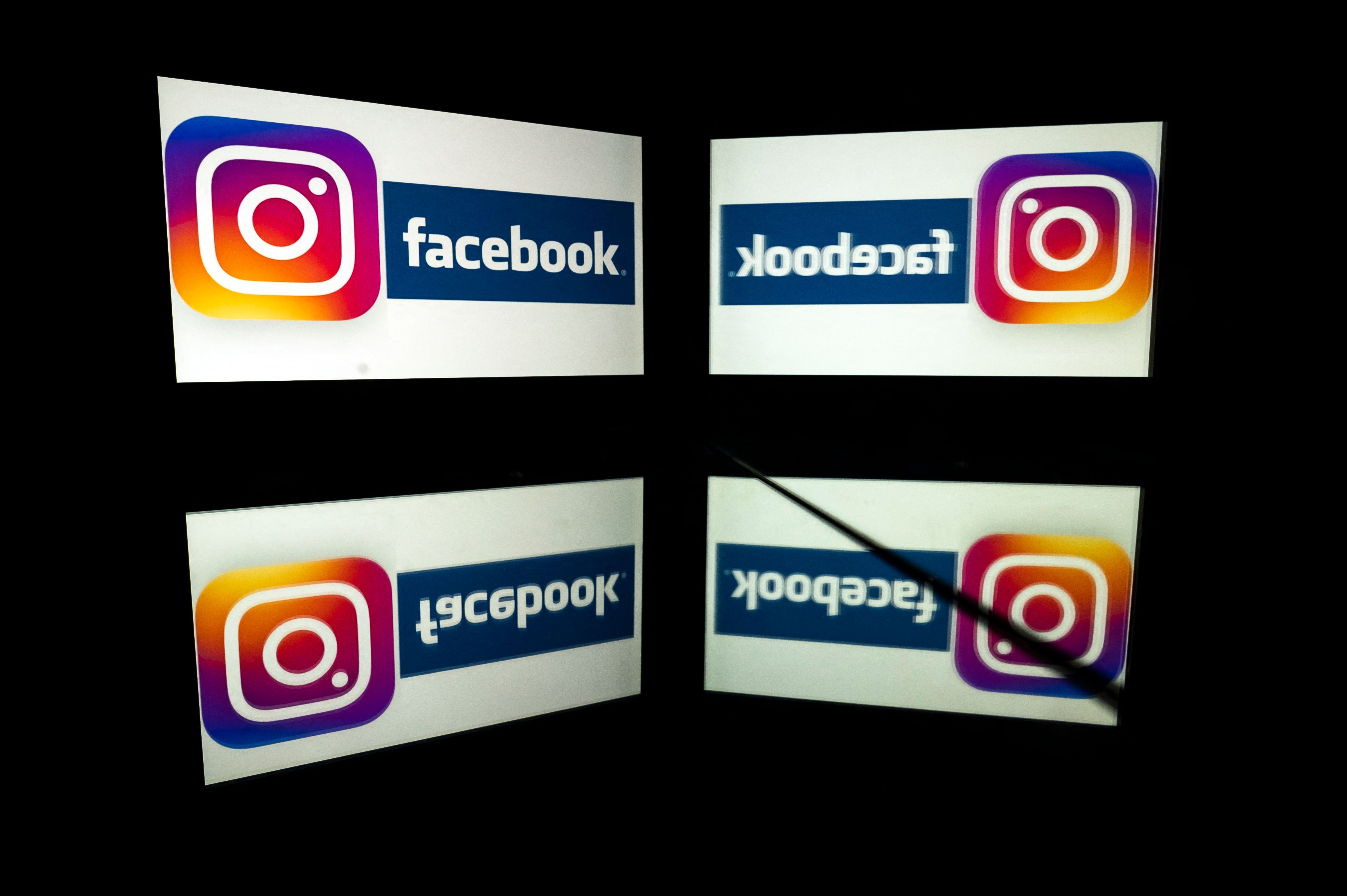 (FILES) this file photo taken on October 05, 2020 in Toulouse, southwestern France, shows logos of US social networks Facebook and Instagram on the screens of a tablet and a mobile phone. - Facebook on October 8, 2021 said some users were having problems accessing its services, just days after a massive outage. 
