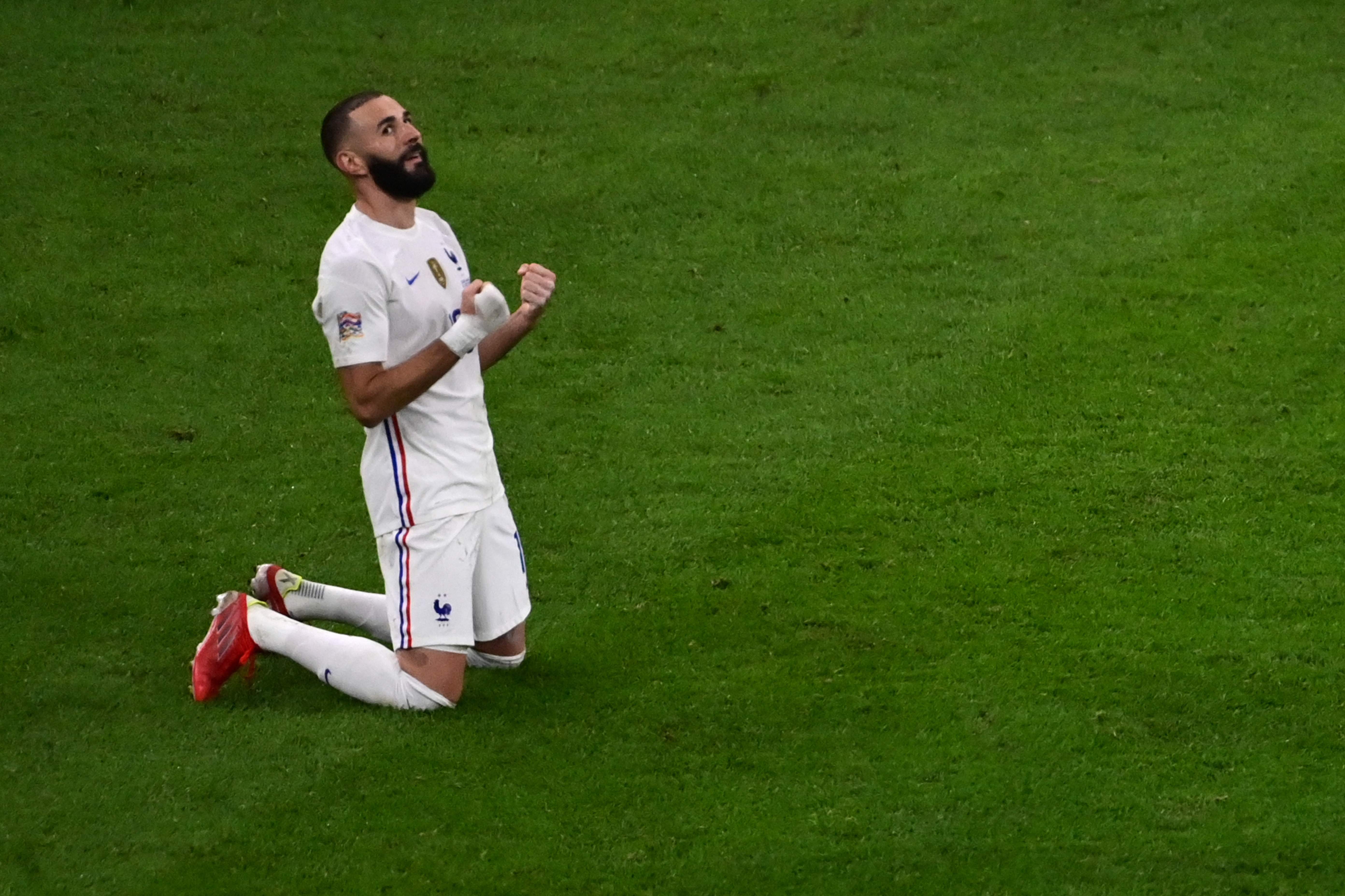 France's forward Karim Benzema celebrates at the end of the Nations League final football match between Spain and France at San Siro stadium in Milan, on October 10, 2021. (Photo by MIGUEL MEDINA / POOL / AFP)