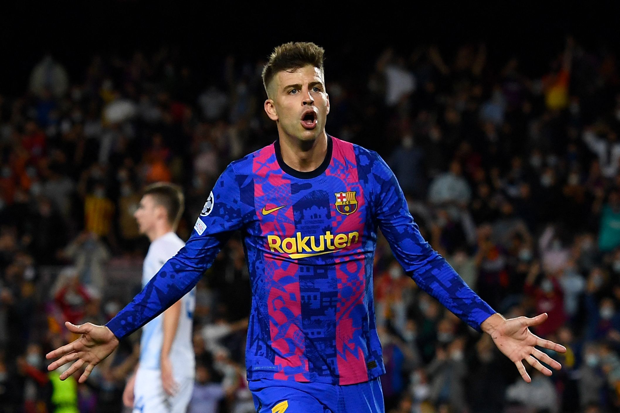 Barcelona's Spanish defender Gerard Pique celebrates after scoring a goal during the UEFA Champions League Group E football match between FC Barcelona and Dynamo Kiev at the Camp Nou stadium in Barcelona on October 20, 2021. (Photo by Josep LAGO / AFP)