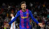 Barcelona's Spanish defender Gerard Pique celebrates after scoring a goal during the UEFA Champions League Group E football match between FC Barcelona and Dynamo Kiev at the Camp Nou stadium in Barcelona on October 20, 2021. (Photo by Josep LAGO / AFP)