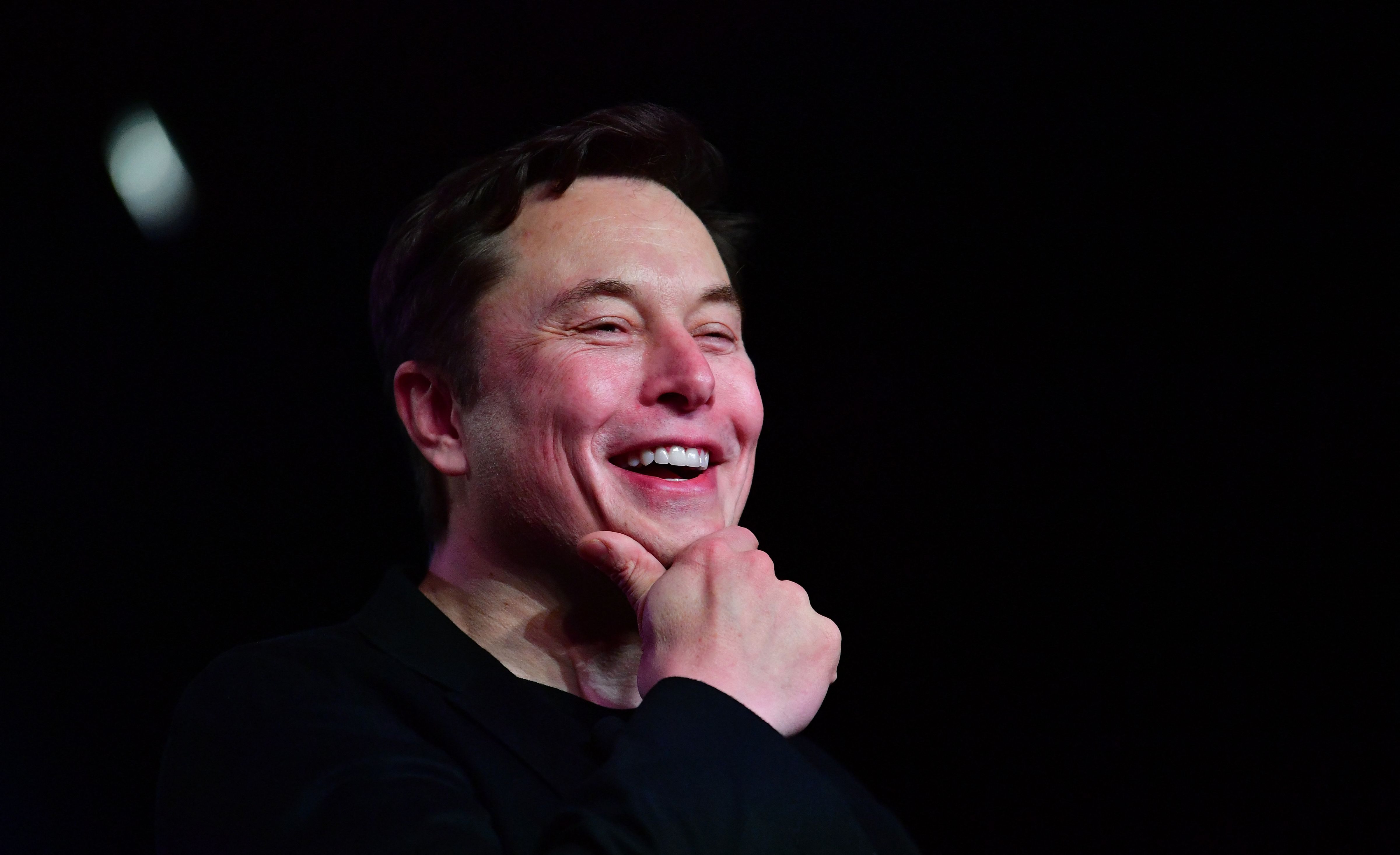 (FILES) In this file photo taken on March 14, 2019 Tesla CEO Elon Musk reacts during the unveiling of the new Tesla Model Y in Hawthorne, California. - Another zany tweet or a real question? Elon Musk polled his more than 62 million Twitter followers Saturday about whether he should sell 10 percent of his Tesla shares, insisting he would do as voters say. The over-the-top electric car maker's query follows a proposal by Congressional Democrats to tax the super-wealthy more heavily by targeting stocks, which are usually only taxed when sold. (Photo by Frederic J. BROWN / AFP)