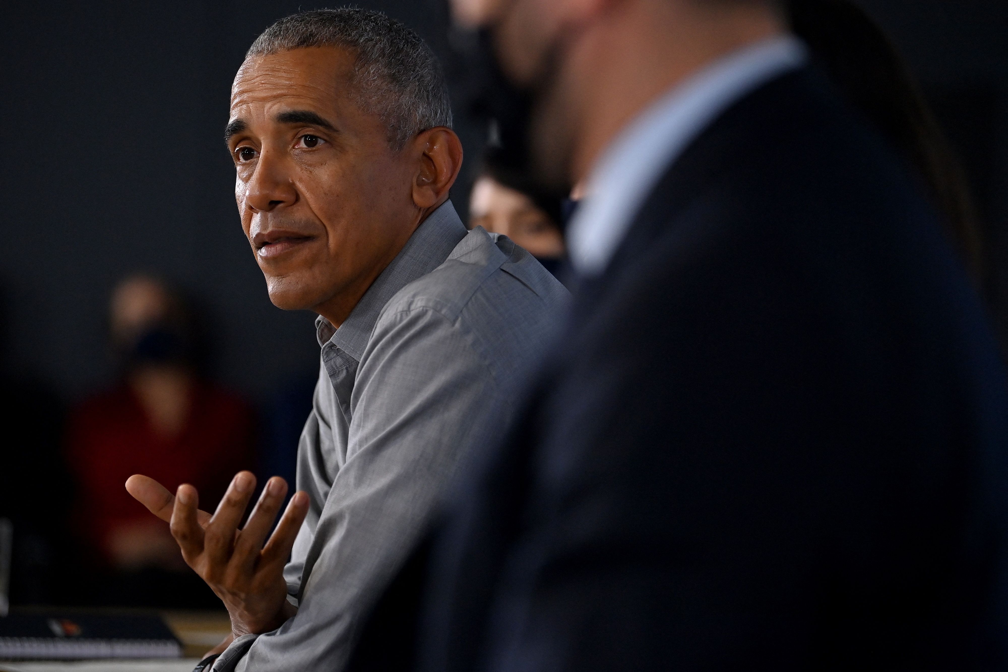 Former US President Barack Obama speaks at an event at the University of Strathclyde in Glasgow on November 8, 2021, during the COP26 UN Climate Change Conference. - The COP26 climate talks resuming Monday have so far unfolded on parallel planes, with high-level announcements stage-managed by host country Britain during week one riding roughshod over a laborious UN process built on consensus among nearly 200 countries. (Photo by Ben STANSALL / AFP)
