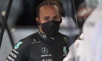Mercedes' British driver Lewis Hamilton is pictured at the team's garage in pit lane during the free practice second session at the Autodromo Jose Carlos Pace, or Interlagos racetrack, in Sao Paulo, on November 13, 2021, ahead of Brazil's Formula One Sao Paulo Grand Prix. - Brazil will hold its F1 Sao Paulo Grand Prix on November 14. (Photo by CARL DE SOUZA / AFP)