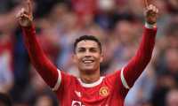 (FILES) This file photo taken on September 11, 2021 shows Manchester United's Portuguese striker Cristiano Ronaldo celebrating after scoring their second goal during the English Premier League football match between Manchester United and Newcastle at Old Trafford in Manchester, north west England. - Lionel Messi appears to be the favourite to succeed himself and win a seventh Ballon d'Or on November 29, 2021 at the Theatre du Chatelet in Paris, where only Robert Lewandowski and Karim Benzema appear to be able to prevent this consecration. (Photo by Oli SCARFF / AFP) / RESTRICTED TO EDITORIAL USE. No use with unauthorized audio, video, data, fixture lists, club/league logos or 'live' services. Online in-match use limited to 120 images. An additional 40 images may be used in extra time. No video emulation. Social media in-match use limited to 120 images. An additional 40 images may be used in extra time. No use in betting publications, games or single club/league/player publications. /