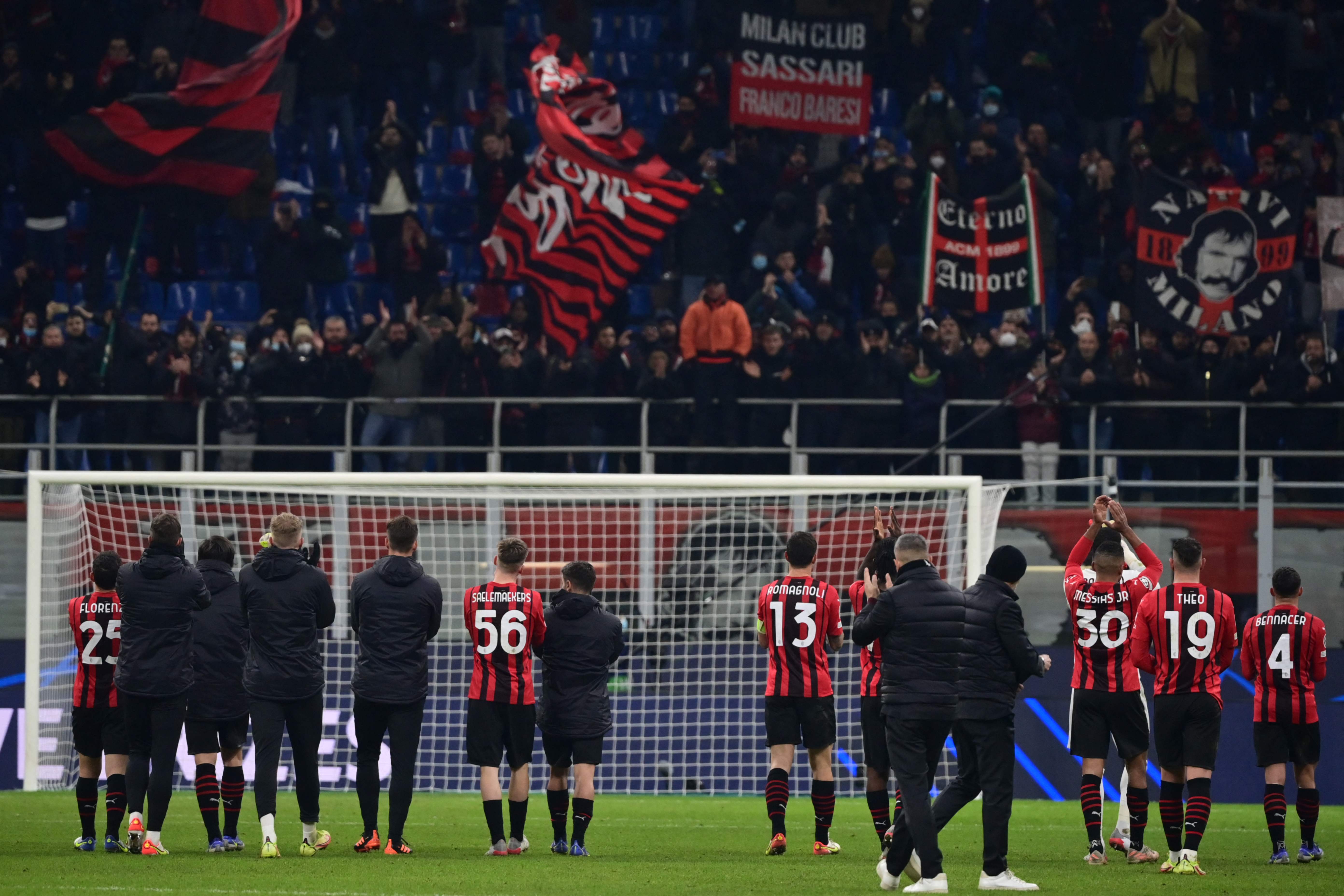 AC Milan players acknowledge the public at the end of the UEFA Champions League Group B football match between AC Milan and Liverpool on December 7, 2021 at the San Siro stadium in Milan. (Photo by MIGUEL MEDINA / AFP)