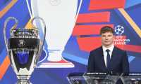 In this handout picture released by the UEFA, Russian former international forward Andrey Arshavin poses by the trophy during the Champions League round of 16 draw at the UEFA headquarters in Nyon, on December 13, 2021. - The first legs are scheduled for 15/16/22/23 February, with the second legs on 8/9/15/16 March. (Photo by Richard JUILLIART / UEFA / AFP) / RESTRICTED TO EDITORIAL USE - MANDATORY CREDIT "AFP PHOTO / UEFA / Richard Juilliart" - NO MARKETING - NO ADVERTISING CAMPAIGNS - DISTRIBUTED AS A SERVICE TO CLIENTS
