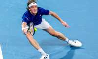 Sydney (Australia), 03/01/2022.- Stefanos Tsitsipas of Team Greece stretches to hit a shot during his match against Diego Schwartzman of Team Argentina on day 3 of the ATP Cup tennis tournament at Qudos Arena in Sydney, Australia, 03 January, 2022. (Tenis, Grecia) EFE/EPA/DAVID GRAY EDITORIAL USE ONLY AUSTRALIA AND NEW ZEALAND OUT