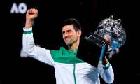 Melbourne (Australia).- (FILE) Novak Djokovic of Serbia lifts the Norman Brooks Challenge Cup after winning his Men's singles finals match against Daniil Medvedev of Russia on Day 14 of the Australian Open Grand Slam tennis tournament at Melbourne Park in Melbourne, Australia, 21 February 2021 (re-isssued 05 January 2022). Novak Djokovic was denied entry to Australia after his visa was refused amid a vaccine exemption row. (Tenis, Abierto, Rusia) EFE/EPA/DAVE HUNT AUSTRALIA AND NEW ZEALAND OUT *** Local Caption *** 56713640