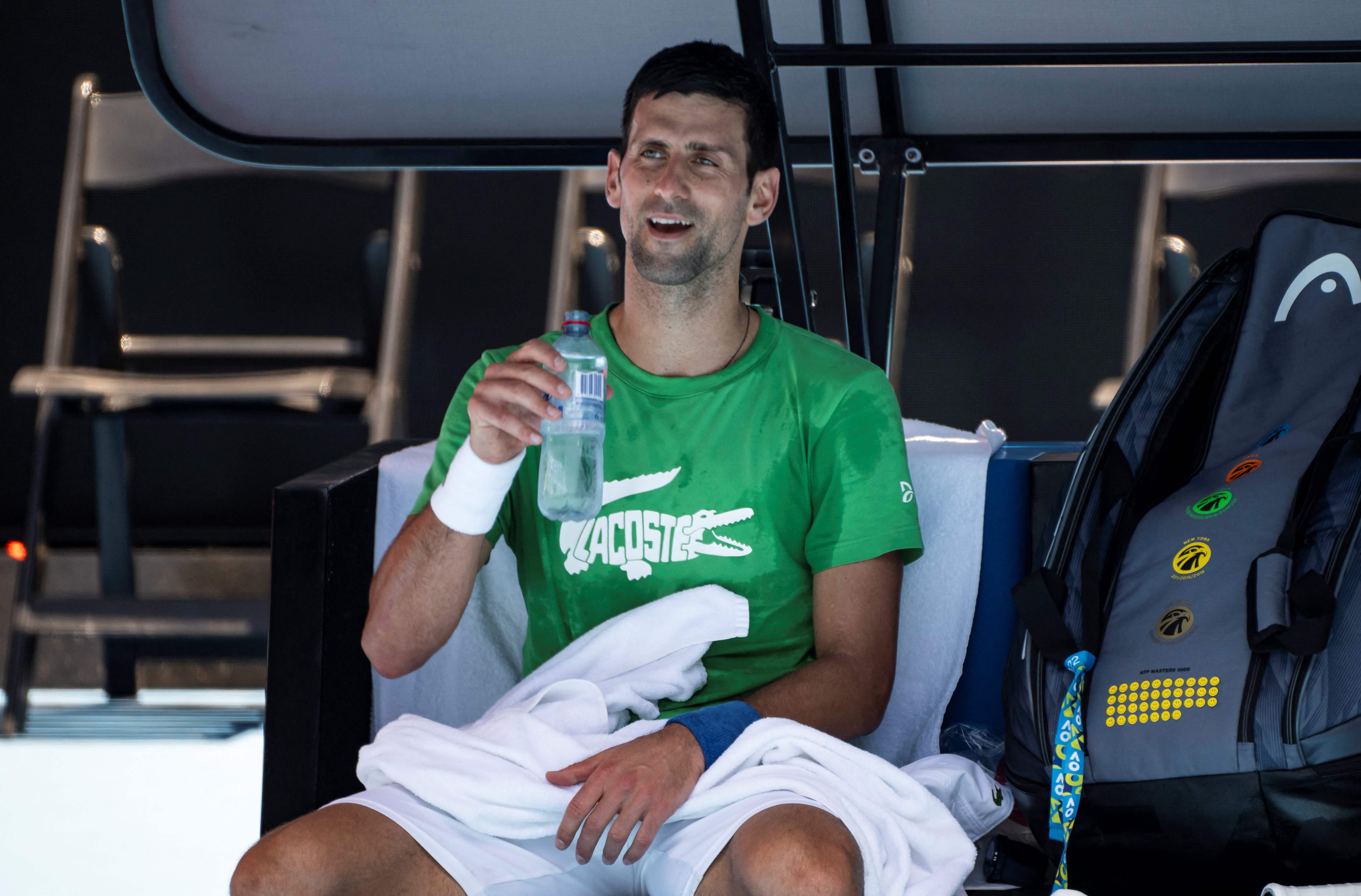 Novak Djokovic of Serbia takes part in a practice session ahead of the Australian Open tennis tournament in Melbourne on January 13, 2022. (Photo by Mike FREY / AFP) / -- IMAGE RESTRICTED TO EDITORIAL USE - STRICTLY NO COMMERCIAL USE --