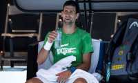 Novak Djokovic of Serbia takes part in a practice session ahead of the Australian Open tennis tournament in Melbourne on January 13, 2022. (Photo by Mike FREY / AFP) / -- IMAGE RESTRICTED TO EDITORIAL USE - STRICTLY NO COMMERCIAL USE --