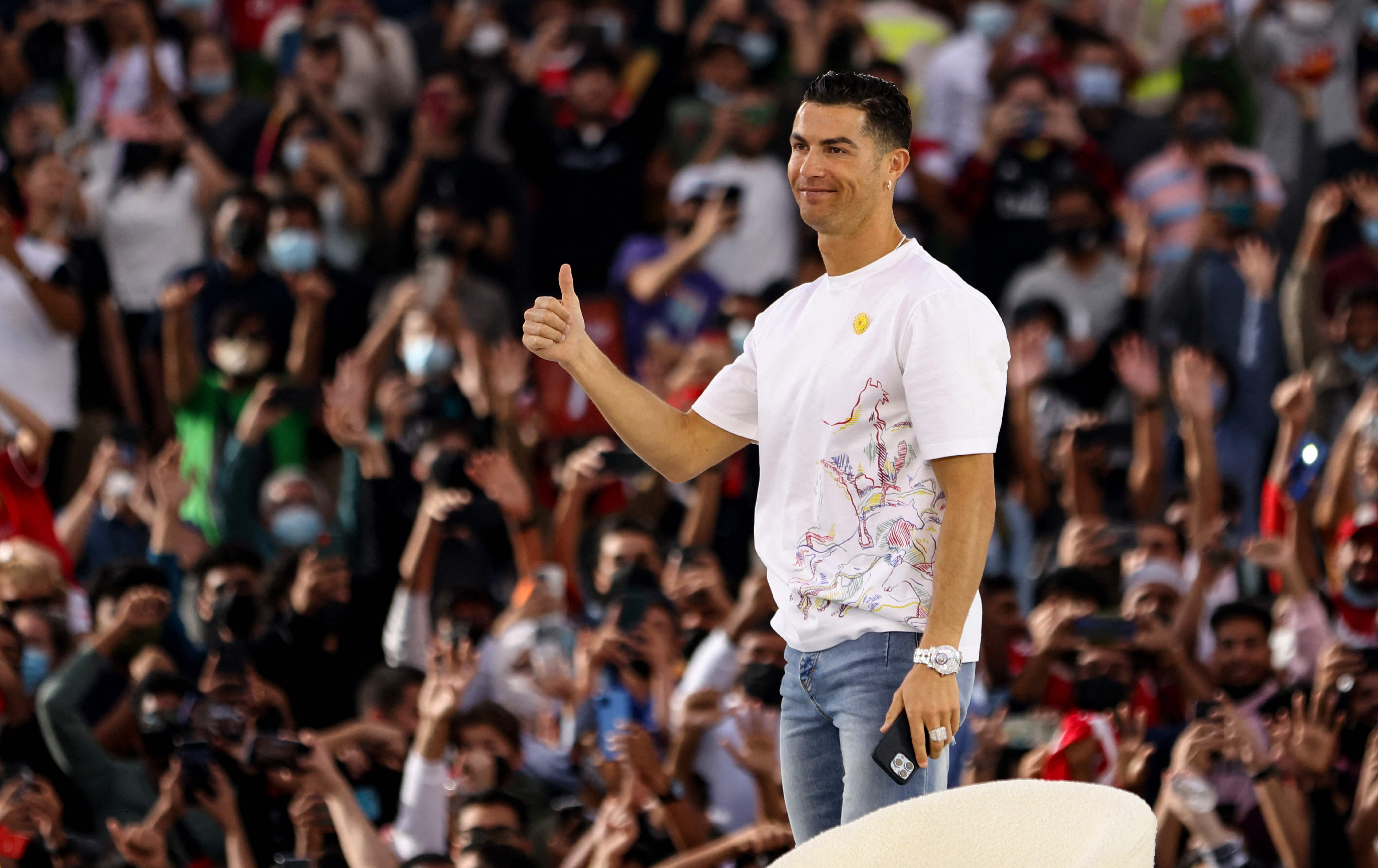 Manchester United's Portuguese striker Cristiano Ronaldo gestures to the crowd at the al-Wasl Dome, during his visit to Expo 2020, in the Gulf emirate of Dubai, on January 28, 2022. (Photo by AFP)