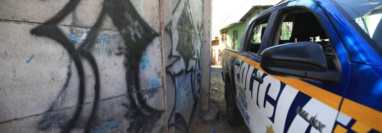 Pintas en paredes evidencian la presencia de pandilleros en Las Trojes, Amatitlán. (Foto Prensa Libre)