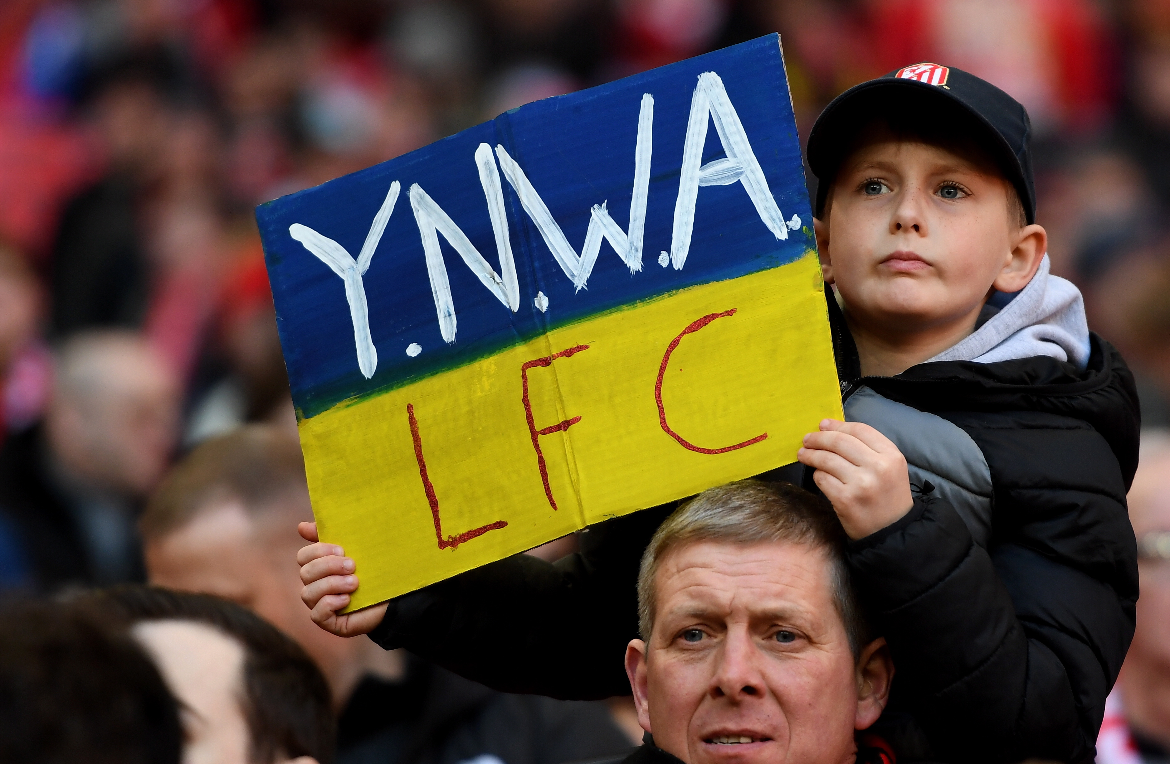 London (United Kingdom), 27/02/2022.- Supporters of Liverpool holds Ukraine flag before the English Carabao Cup final match between Chelsea FC and Liverpool FC at the Wembley stadium in London, Britain, 27 February 2022. (Ucrania, Reino Unido, Londres) EFE/EPA/Andy Rain EDITORIAL USE ONLY. No use with unauthorized audio, video, data, fixture lists, club/league logos or 'live' services. Online in-match use limited to 120 images, no video emulation. No use in betting, games or single club/league/player publications