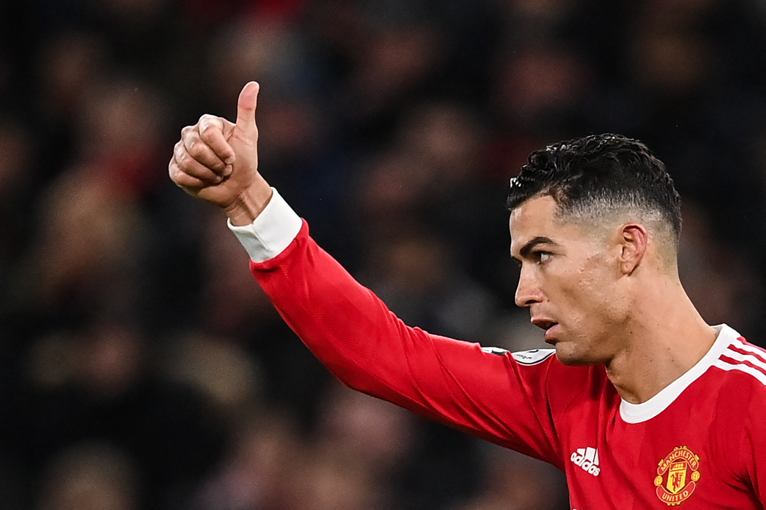 Manchester United's Portuguese striker Cristiano Ronaldo reacts during the English Premier League football match between Manchester United and Brighton at Old Trafford in Manchester, north west England, on February 15, 2022. (Photo by Paul ELLIS / AFP) / RESTRICTED TO EDITORIAL USE. No use with unauthorized audio, video, data, fixture lists, club/league logos or 'live' services. Online in-match use limited to 120 images. An additional 40 images may be used in extra time. No video emulation. Social media in-match use limited to 120 images. An additional 40 images may be used in extra time. No use in betting publications, games or single club/league/player publications. /
