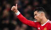 Manchester United's Portuguese striker Cristiano Ronaldo reacts during the English Premier League football match between Manchester United and Brighton at Old Trafford in Manchester, north west England, on February 15, 2022. (Photo by Paul ELLIS / AFP) / RESTRICTED TO EDITORIAL USE. No use with unauthorized audio, video, data, fixture lists, club/league logos or 'live' services. Online in-match use limited to 120 images. An additional 40 images may be used in extra time. No video emulation. Social media in-match use limited to 120 images. An additional 40 images may be used in extra time. No use in betting publications, games or single club/league/player publications. /