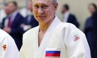 (FILES) In this file photo taken on February 14, 2019 Russian President Vladimir Putin takes part in a training session with members of the Russian national judo team in Sochi. - Russian president Vladimir Putin has been suspended as honorary president of the International Judo Federation (IJF) due to Russia's invasion of Ukraine the sport's governing body announced on February 27. (Photo by Mikhail KLIMENTYEV / SPUTNIK / AFP)