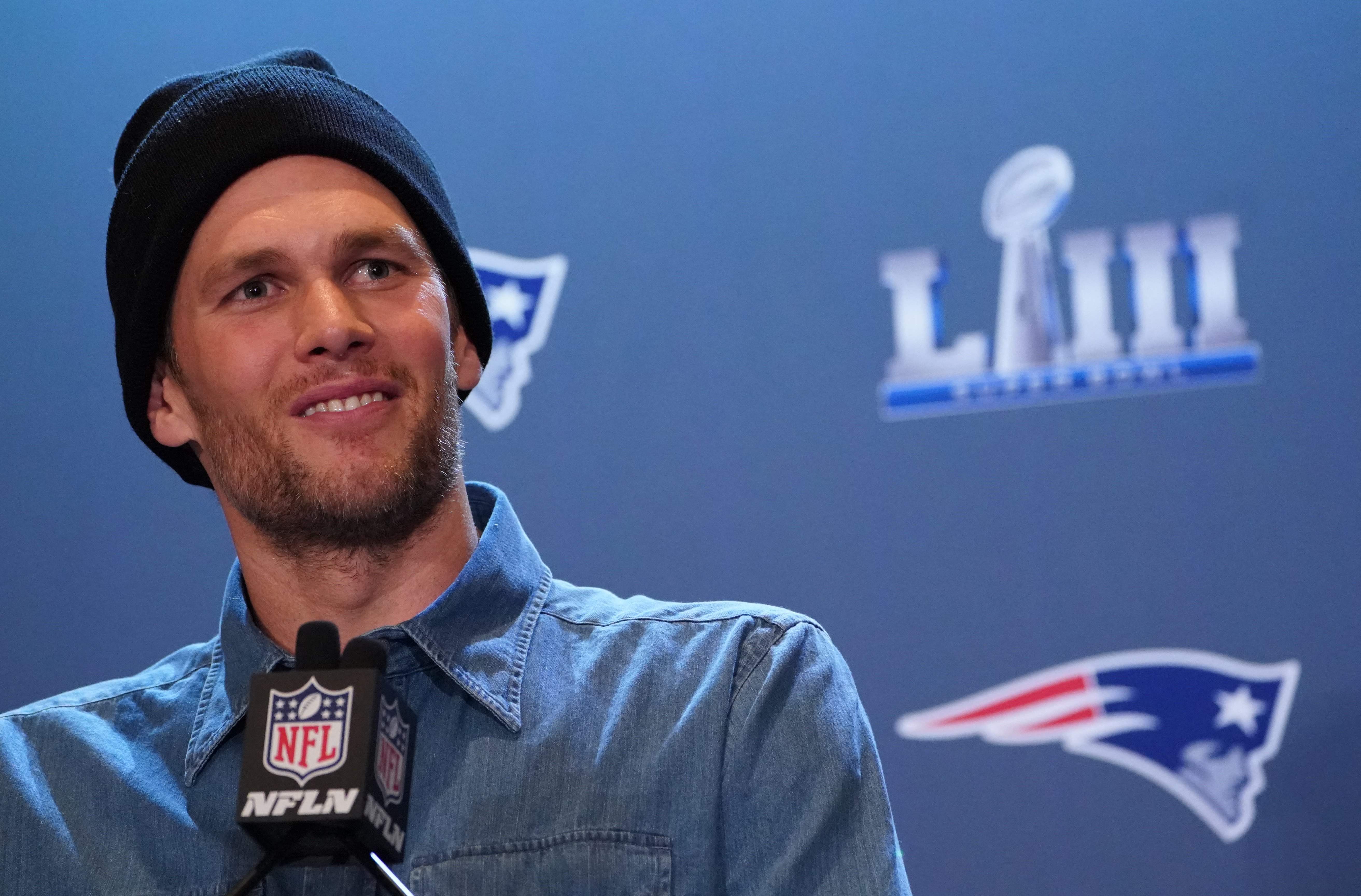 (FILES) In this file photo taken on January 31, 2019, New England Patriots quarterback Tom Brady talks to the press during a media availability in the Super Bowl Media Center at the World Congress Center in Atlanta, Georgia. - NFL icon Tom Brady confirmed his retirement from the sport on February 1, 2022, officially bringing the curtain down on a glittering 22-season career. The 44-year-old superstar, widely regarded as the greatest quarterback in history, made the announcement in a post on Instagram. (Photo by TIMOTHY A. CLARY / AFP)