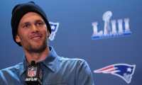 (FILES) In this file photo taken on January 31, 2019, New England Patriots quarterback Tom Brady talks to the press during a media availability in the Super Bowl Media Center at the World Congress Center in Atlanta, Georgia. - NFL icon Tom Brady confirmed his retirement from the sport on February 1, 2022, officially bringing the curtain down on a glittering 22-season career. The 44-year-old superstar, widely regarded as the greatest quarterback in history, made the announcement in a post on Instagram. (Photo by TIMOTHY A. CLARY / AFP)