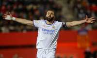 Real Madrid's French forward Karim Benzema celebrates after scoring his team's second goal during the Spanish League football match between RCD Mallorca and Real Madrid CF at the Son Moix stadium in Palma de Mallorca on March 14, 2022. (Photo by JAIME REINA / AFP)