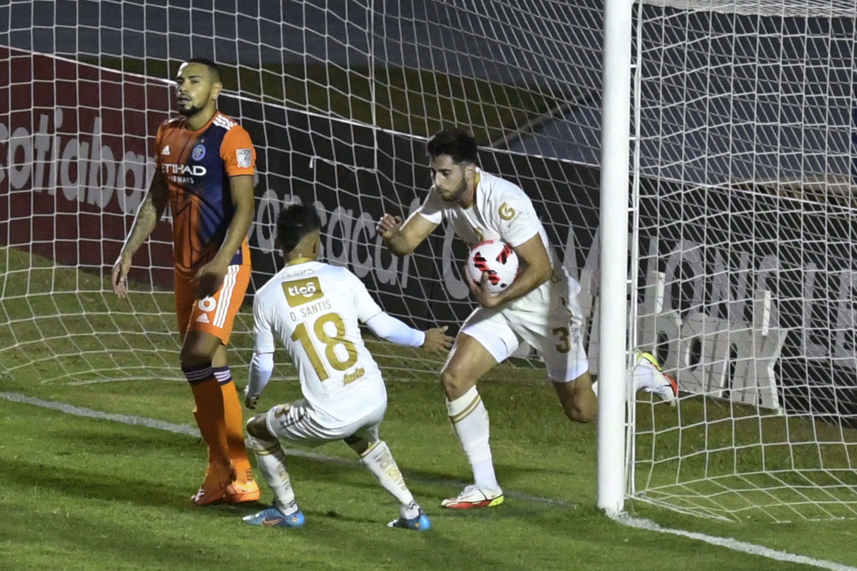 Guatemala's Comunicaciones Andres Lezcano (R) celebrates with teammate after scoring against US' New York City FC during their Concacaf Champions League quarterfinals football match at the Doroteo Guamuch stadium in Guatemala City, on March 15, 2022. (Photo by Johan ORDONEZ / AFP)