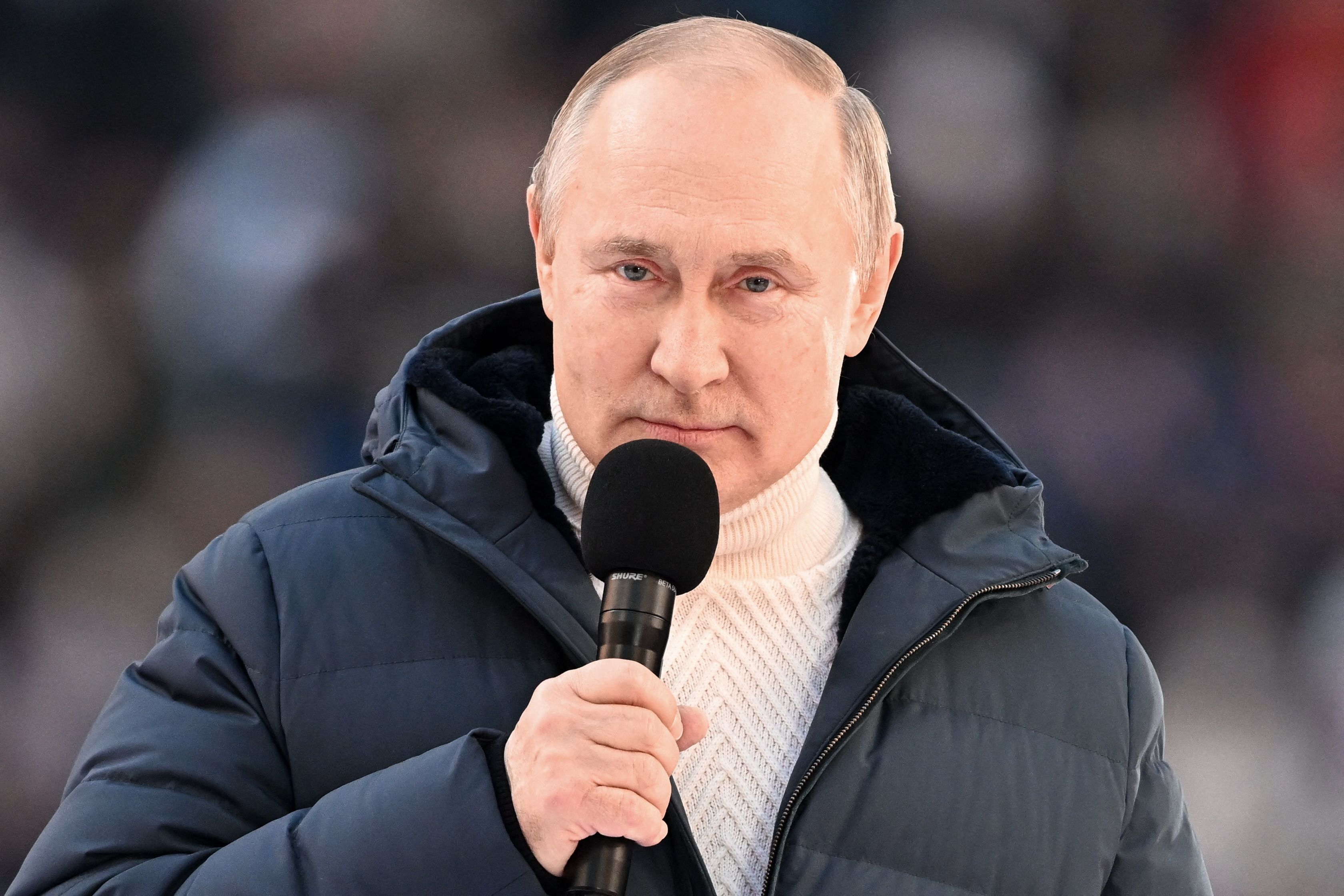 Russian President Vladimir Putin gives a speech at a concert marking the eighth anniversary of Russia's annexation of Crimea at the Luzhniki stadium in Moscow on March 18, 2022. (Photo by Ramil SITDIKOV / POOL / AFP)