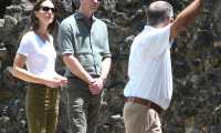 Britain's Prince William (C), Duke of Cambridge and Britain's Catherine (L), Duchess of Cambridge, tour the Caracol Mayan archaeological site at the Chiquibul Forest Reserve, in Good Living Camp, Belize on March 21, 2022. (Photo by Johan ORDONEZ / AFP)