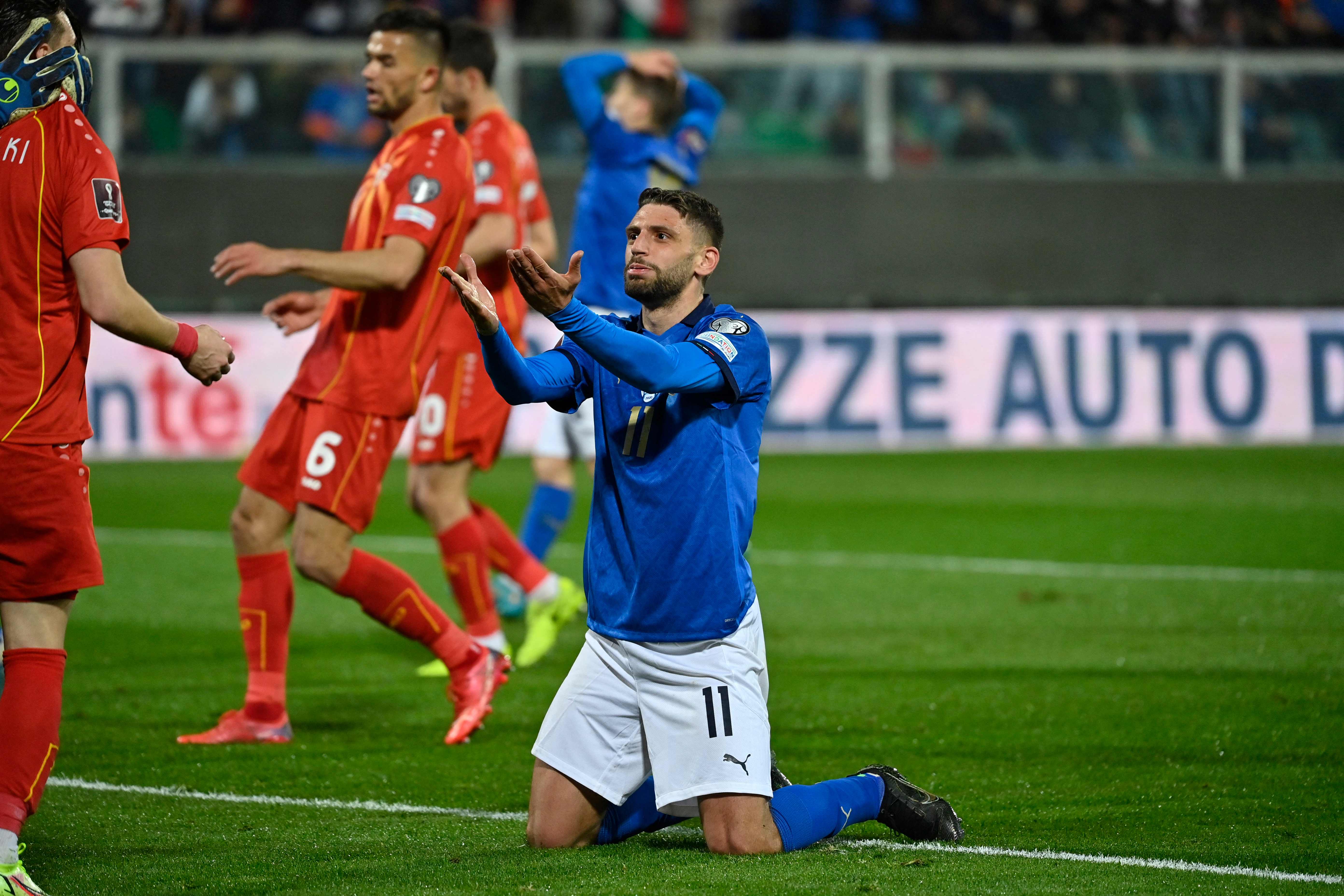 Italy's forward Domenico Berardi reacts after missing a goal opportunity during the 2022 World Cup qualifying play-off football match between Italy and North Macedonia, on March 24, 2022 at the Renzo-Barbera stadium in Palermo. (Photo by Alberto PIZZOLI / AFP)