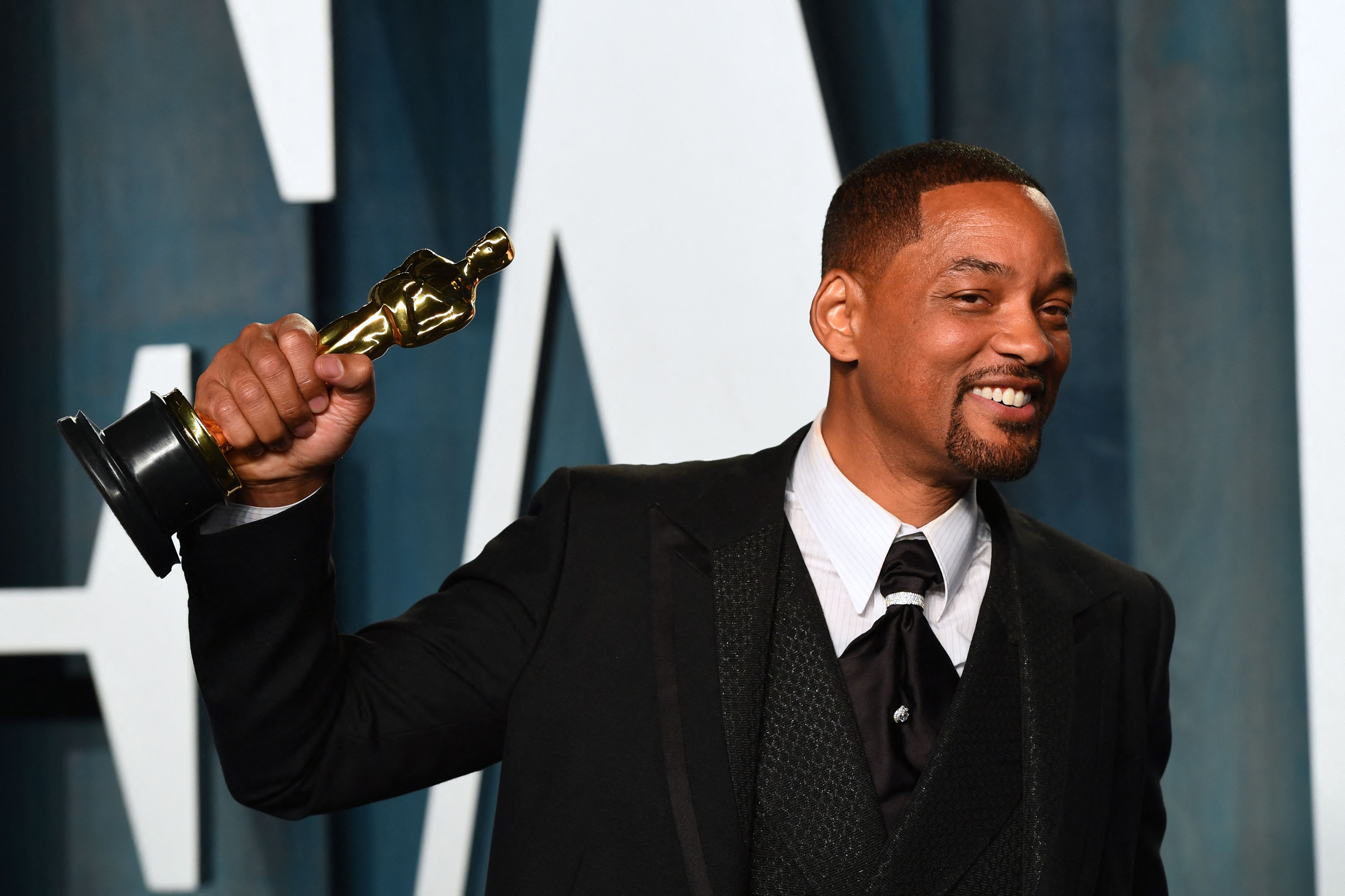 (FILES) In this file photo taken on March 28, 2022 US actor Will Smith holds his award for Best Actor in a Leading Role for "King Richard" as he attends the 2022 Vanity Fair Oscar Party following the 94th Oscars at the The Wallis Annenberg Center for the Performing Arts in Beverly Hills, California. - Will Smith has tendered his resignation from the body that awards the Oscars after his attack on Chris Rock during the weekend ceremony, a statement said April 1, 2022. (Photo by Patrick T. FALLON / AFP)