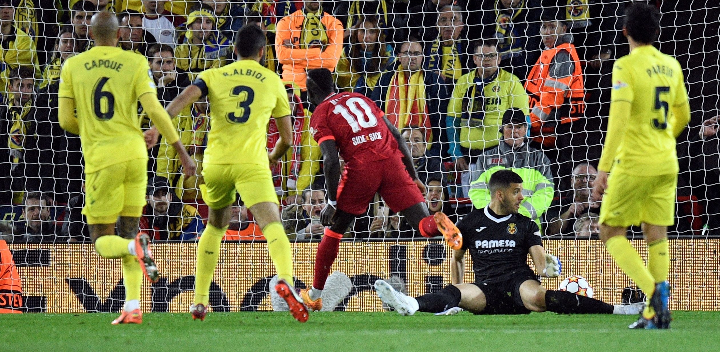 Liverpool's Senegalese striker Sadio Mane scores his team second goal during the UEFA Champions League semi-final first leg football match between Liverpool and Villarreal, at the Anfield Stadium, in Liverpool, on April 27, 2022. (Photo by Oli SCARFF / AFP)