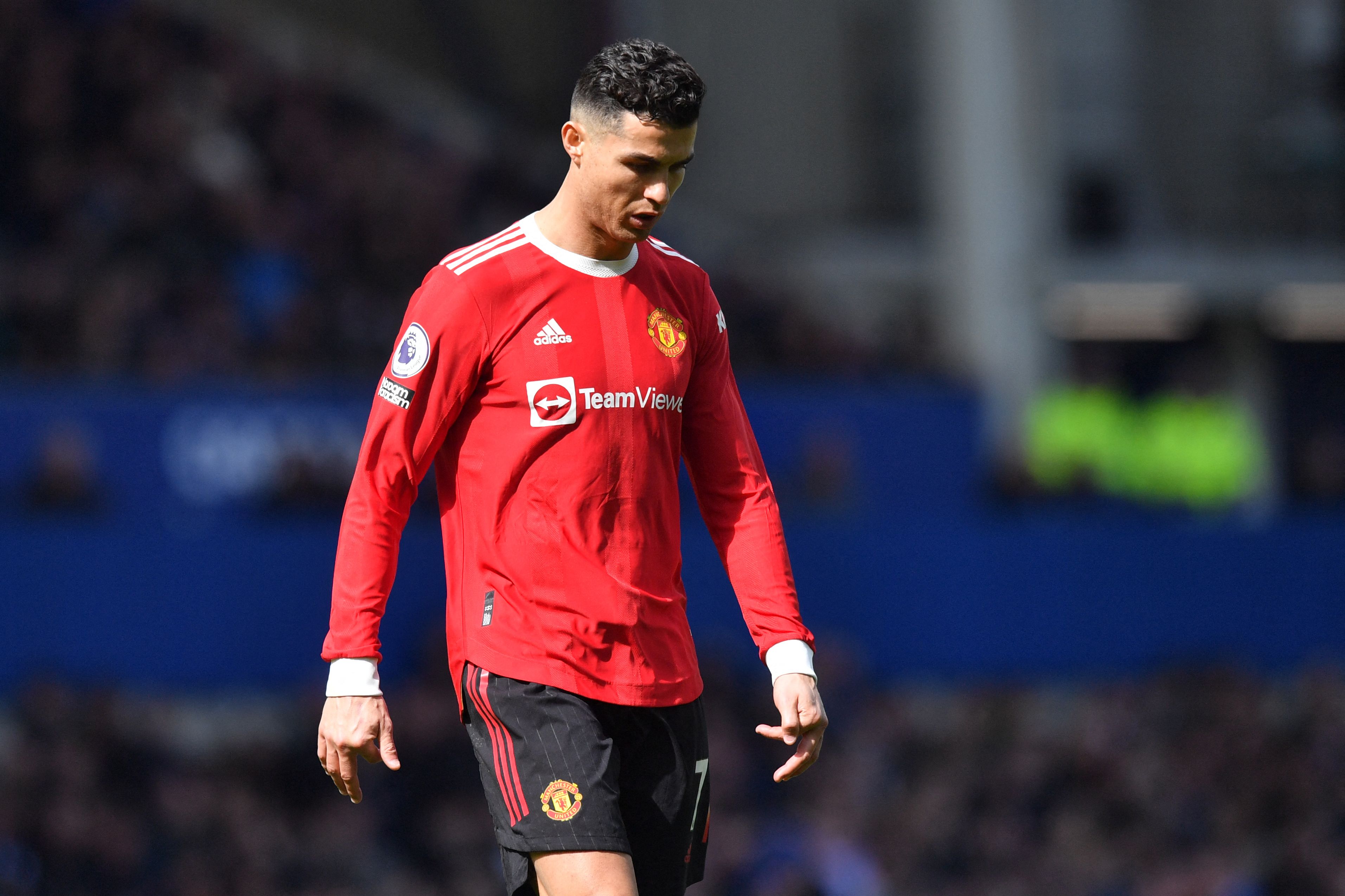 Manchester United's Portuguese striker Cristiano Ronaldo reacts during the English Premier League football match between Everton and Manchester United at Goodison Park in Liverpool, north west England on April 9, 2022. (Photo by Anthony Devlin / AFP) / RESTRICTED TO EDITORIAL USE. No use with unauthorized audio, video, data, fixture lists, club/league logos or 'live' services. Online in-match use limited to 120 images. An additional 40 images may be used in extra time. No video emulation. Social media in-match use limited to 120 images. An additional 40 images may be used in extra time. No use in betting publications, games or single club/league/player publications. /