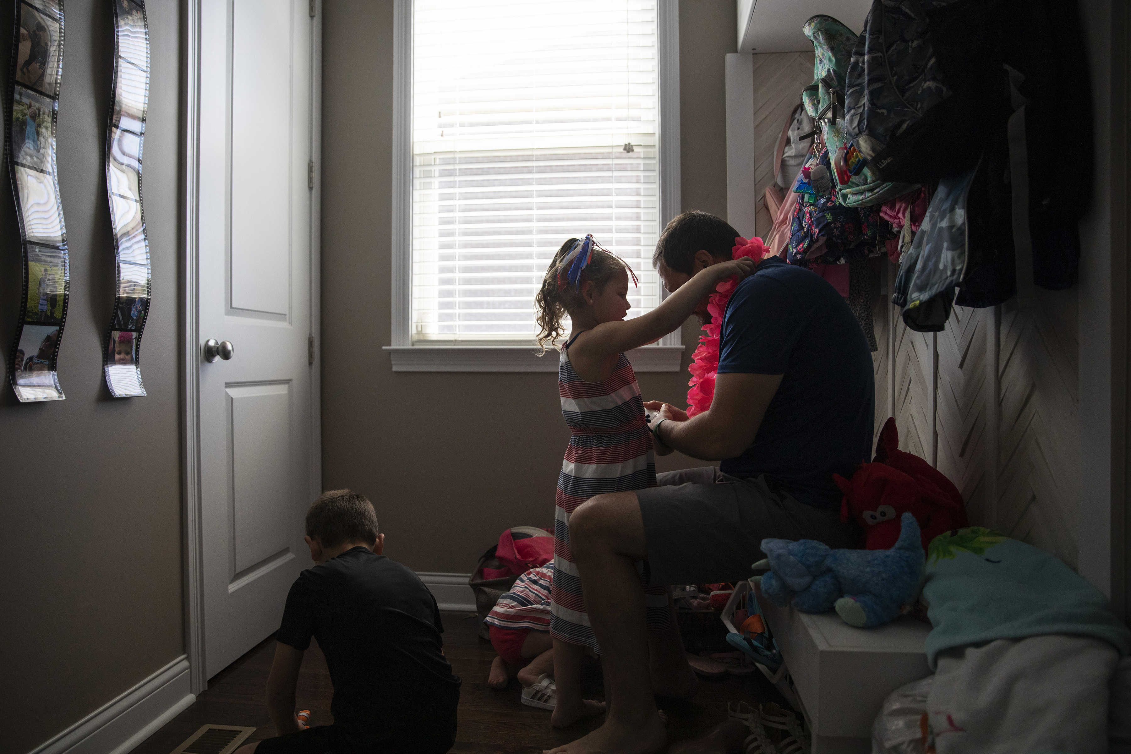Jack Widders puts sunscreen on his daughter, Liviah, who received a liver transplant in January, before heading outside at their home in Mason, Ohio, May 30, 2022. ÒSheÕs not going to remember a lot of it, which is so great,Ó he said. (Maddie McGarvey/The New York Times)