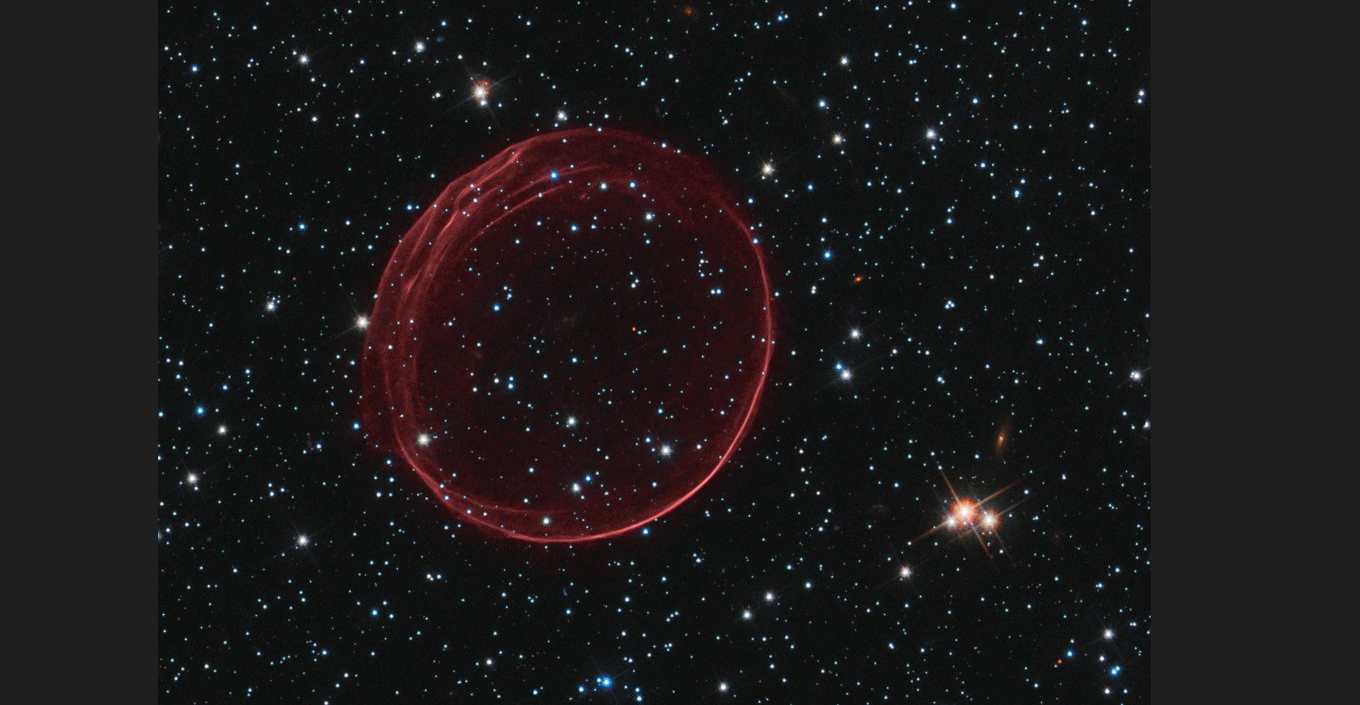 Una burbuja conocida como SNR 0509-67.5, el remanente visible de una explosión estelar en la Gran Nube de Magallanes, a unos 160.000 años luz de la Tierra. (NASA, ESA y el Hubble Heritage Team [STScI/AURA] vía The New York Times)