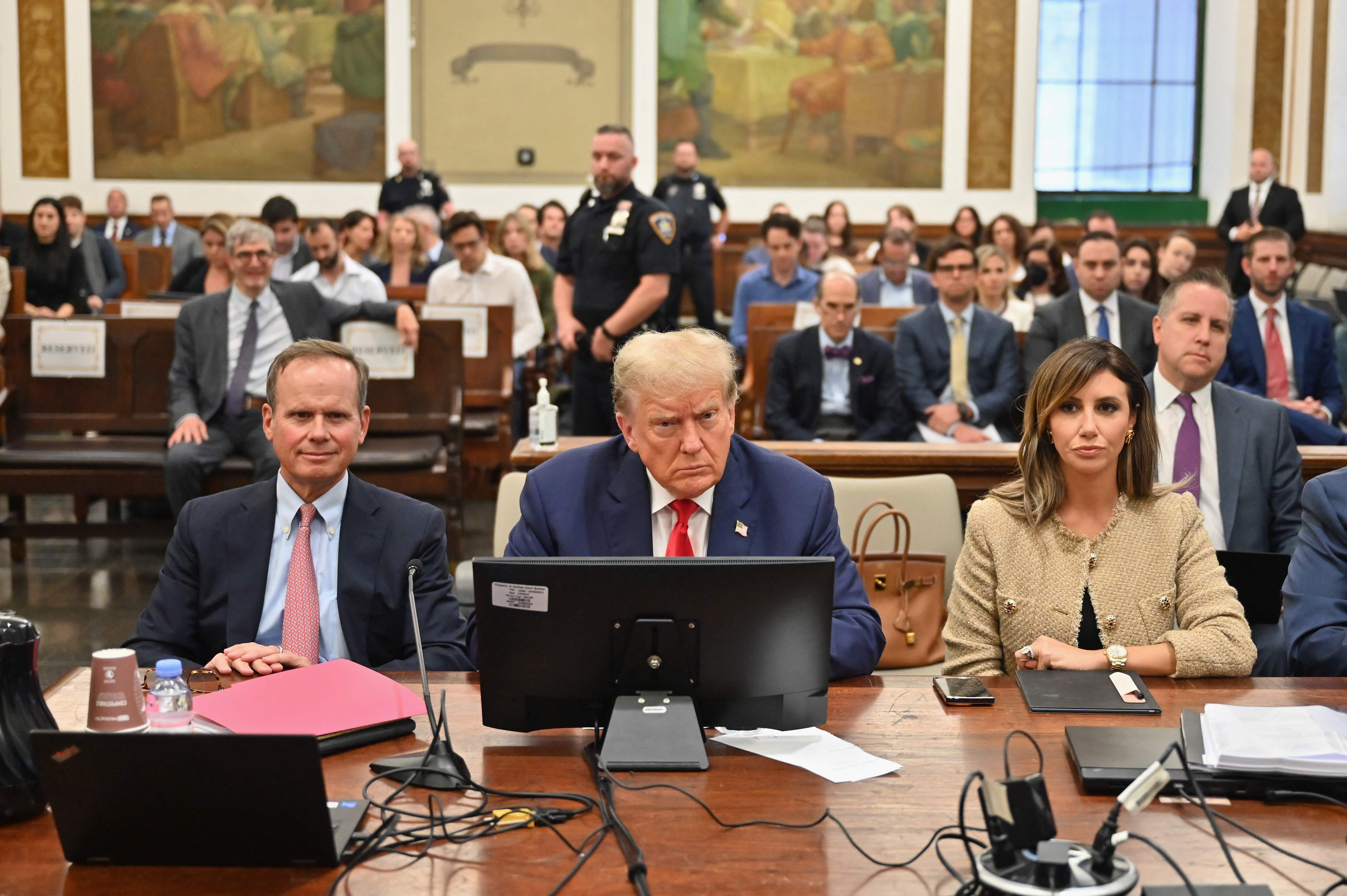 (FILES) Former US President Donald Trump (C) attends the third day of his civil fraud trial in New York on October 4, 2023. A US judge ordered Trump on February 16, 2024 to pay nearly $355 million after finding him liable for fraud and banned him from running businesses in New York state for three years. (Photo by ANGELA WEISS / AFP)