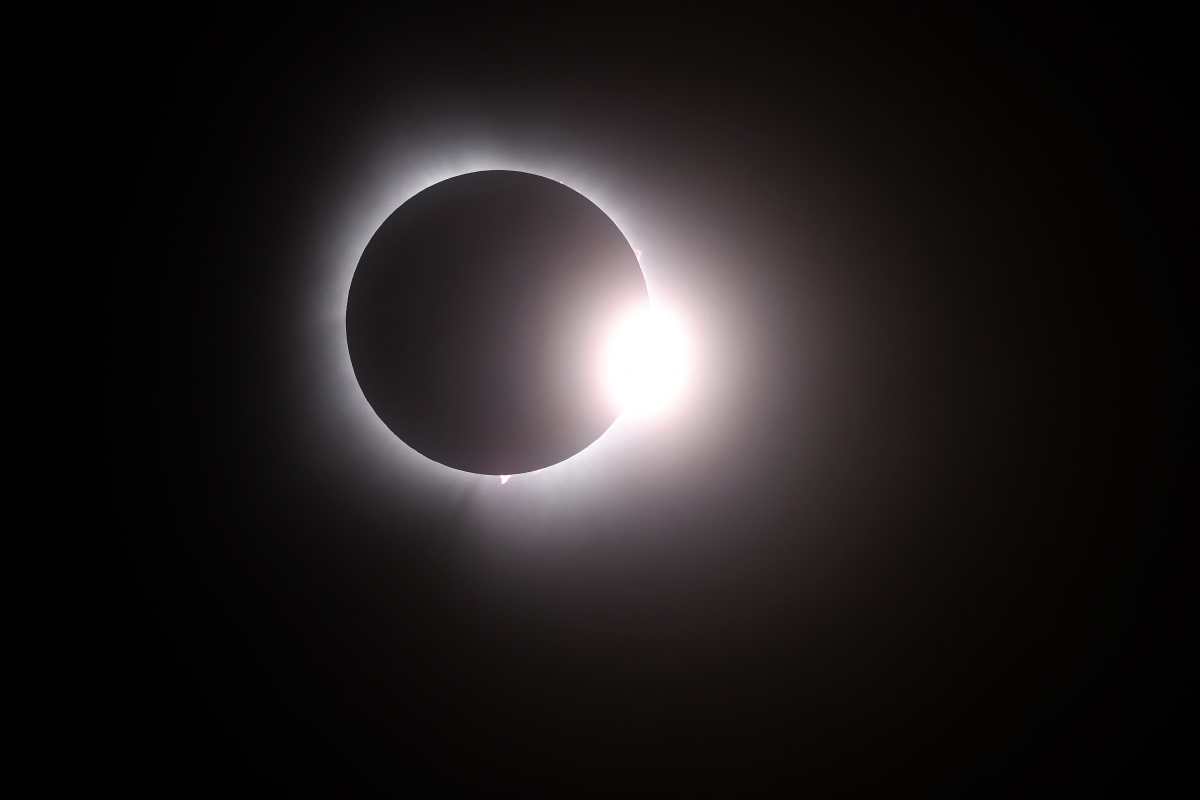 MARTIN, OHIO - APRIL 08: The moon passes in front of the sun during a solar eclipse on April 08, 2024 in Martin Ohio. Millions of people have flocked to areas across North America that are in the "path of totality" in order to experience a total solar eclipse. During the event, the moon will pass in between the sun and the Earth, appearing to block the sun.   Gregory Shamus/Getty Images/AFP (Photo by Gregory Shamus / GETTY IMAGES NORTH AMERICA / Getty Images via AFP)