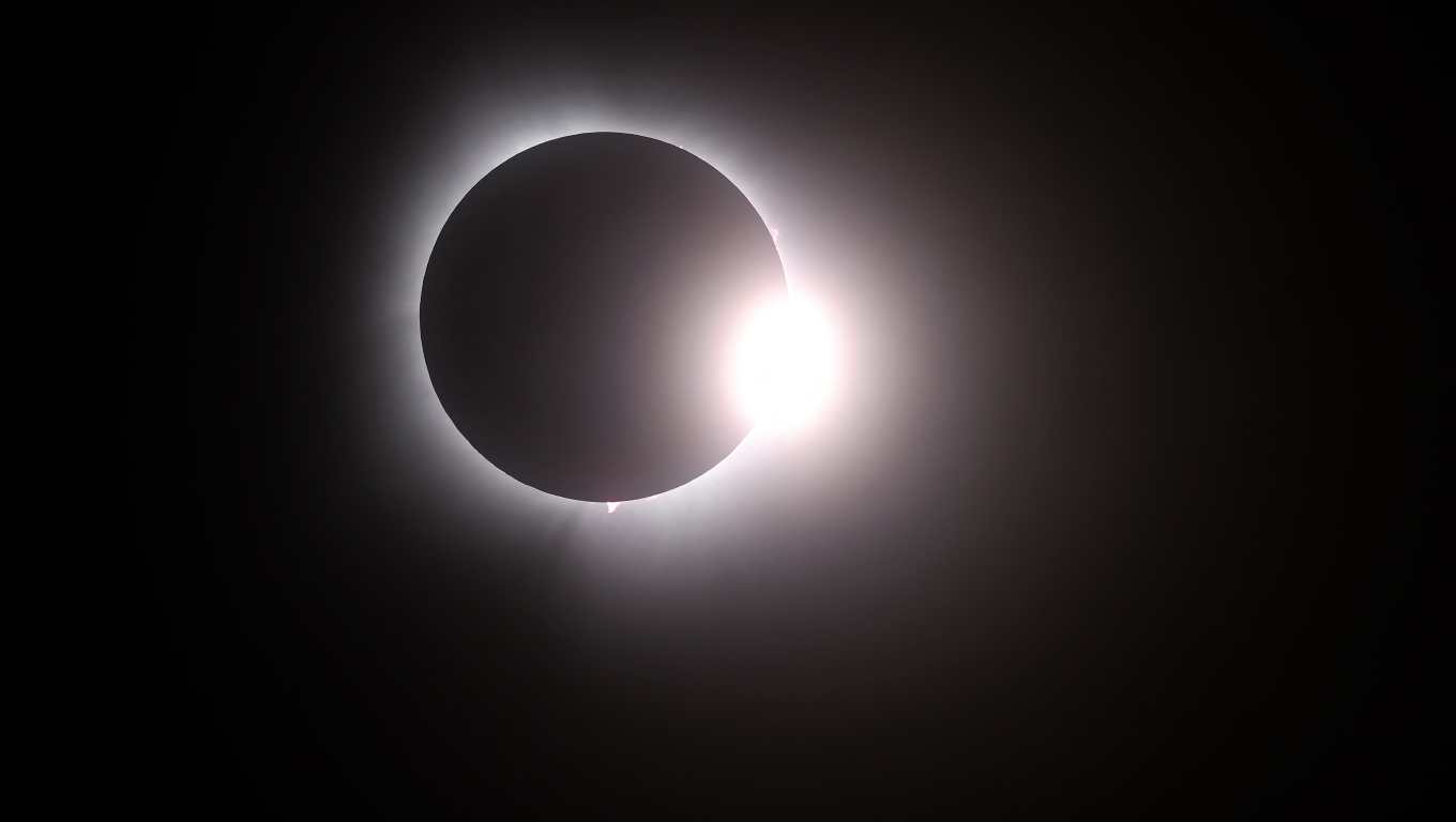 MARTIN, OHIO - APRIL 08: The moon passes in front of the sun during a solar eclipse on April 08, 2024 in Martin Ohio. Millions of people have flocked to areas across North America that are in the "path of totality" in order to experience a total solar eclipse. During the event, the moon will pass in between the sun and the Earth, appearing to block the sun. Gregory Shamus/Getty Images/AFP (Photo by Gregory Shamus / GETTY IMAGES NORTH AMERICA / Getty Images via AFP)